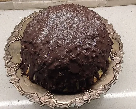 The family’s favourite ice cream bombe with chocolate shell, dusted with edible glitter