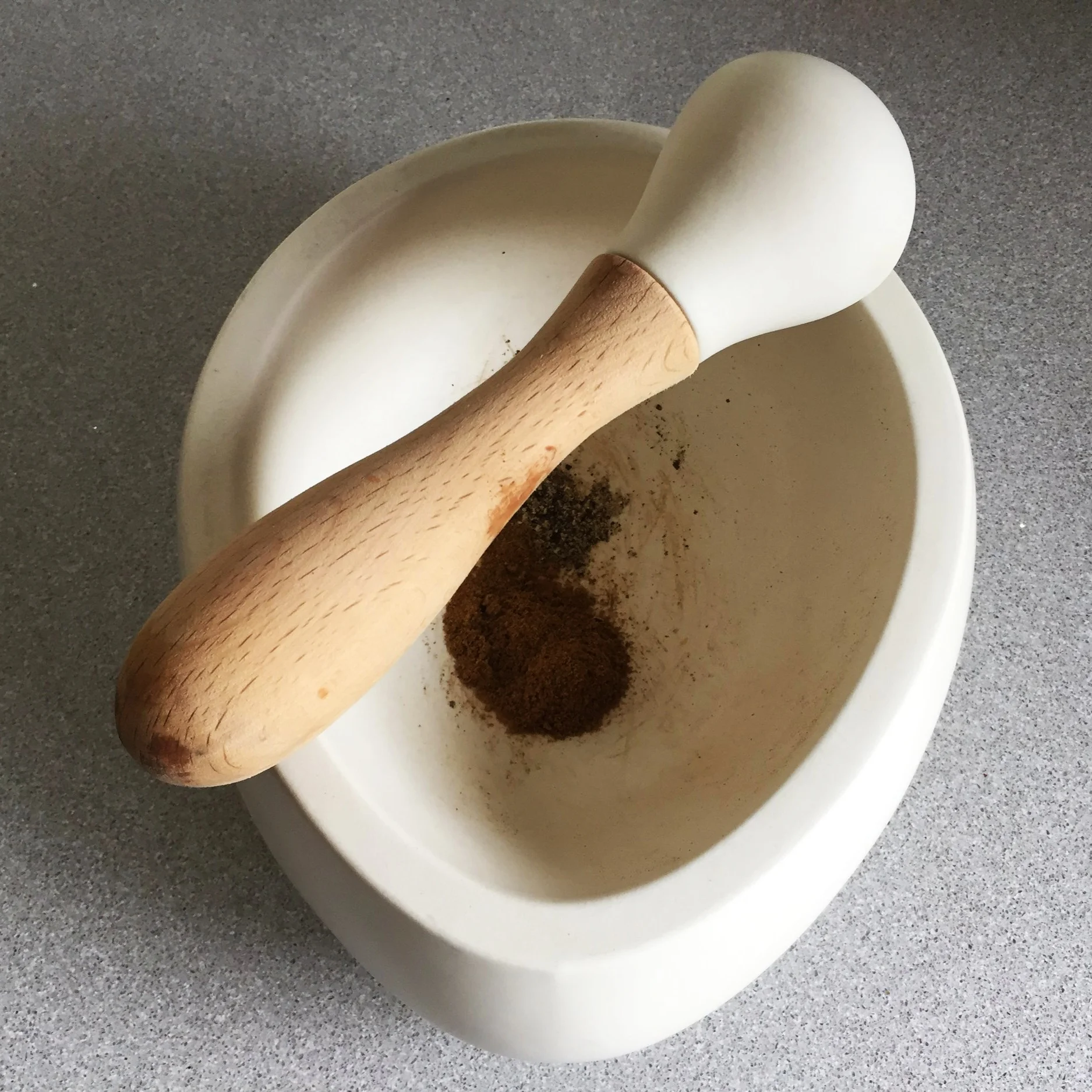 Grinding the spices for Salt Lime Soda fudge: cumin & black pepper