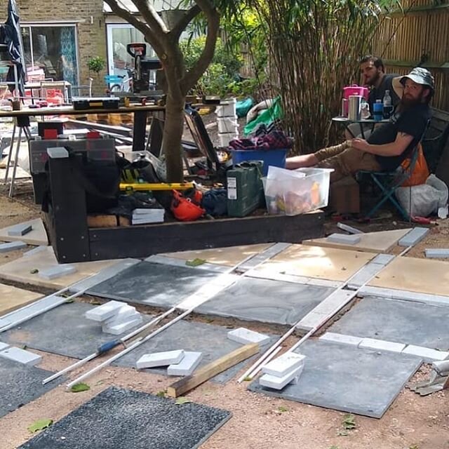 Lunch break while we lay out this geometric patio with a nod to Morocco at a villa in south London. We've started the pergola in shou sugi ban (scorched timber) here as well. 
#lookoutside #iongardens #bespoke #patio #pergola #shousugiban #shousugiba