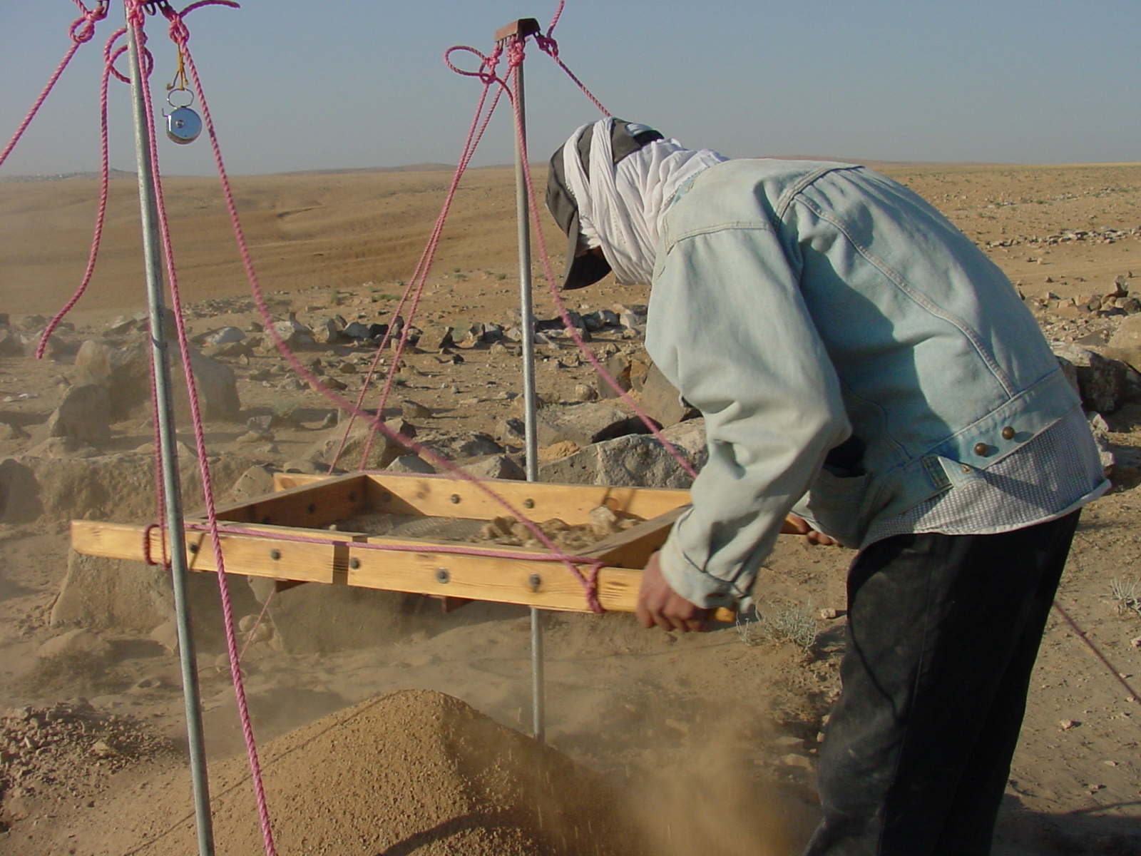   Remaining sherds are removed from the screen and placed in a plastic pail that is tagged with a specific number at the foot of the sift. This pail number is from that point on associated with the sherds placed in it  