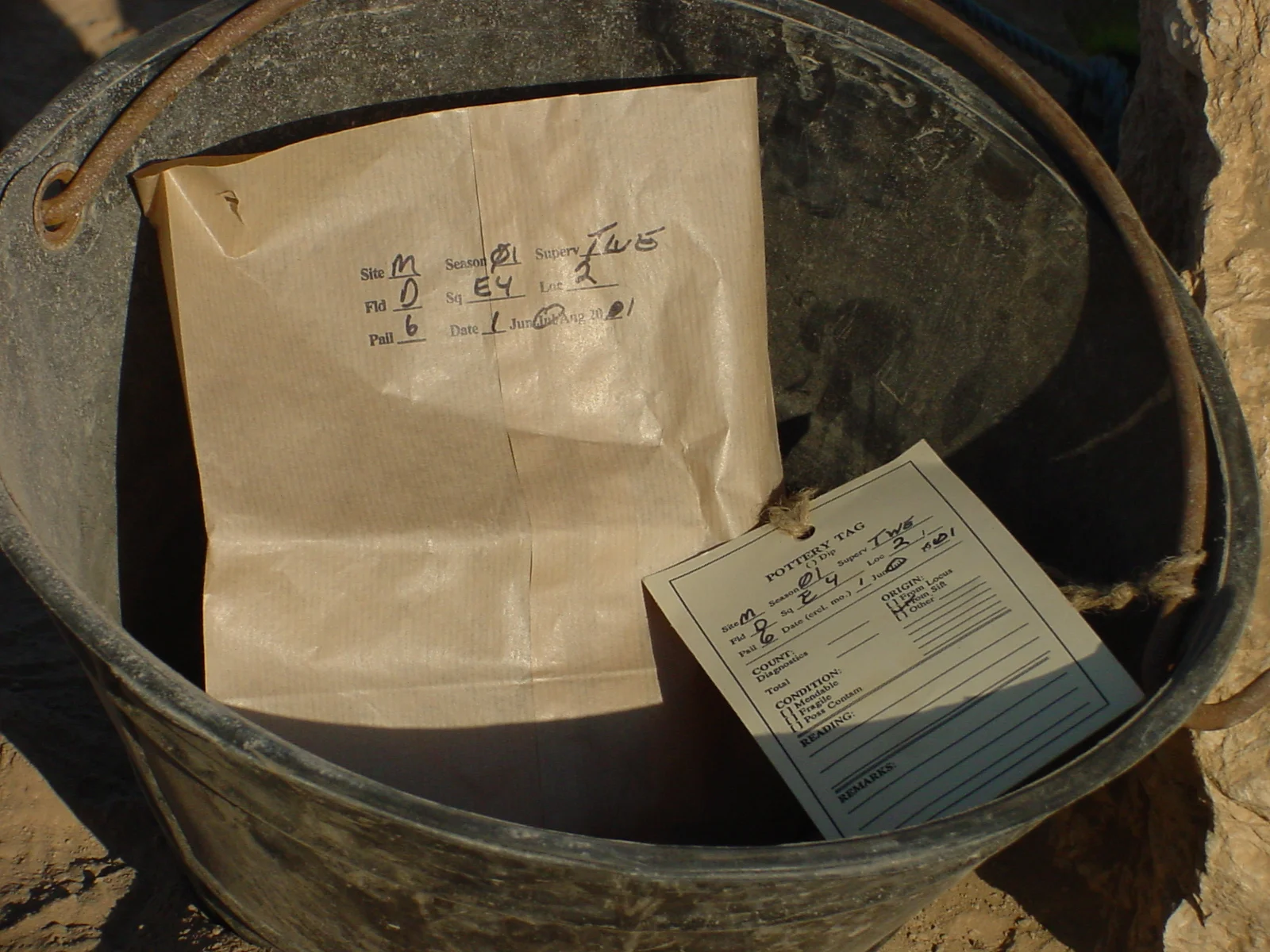   Pottery pail with tag.  