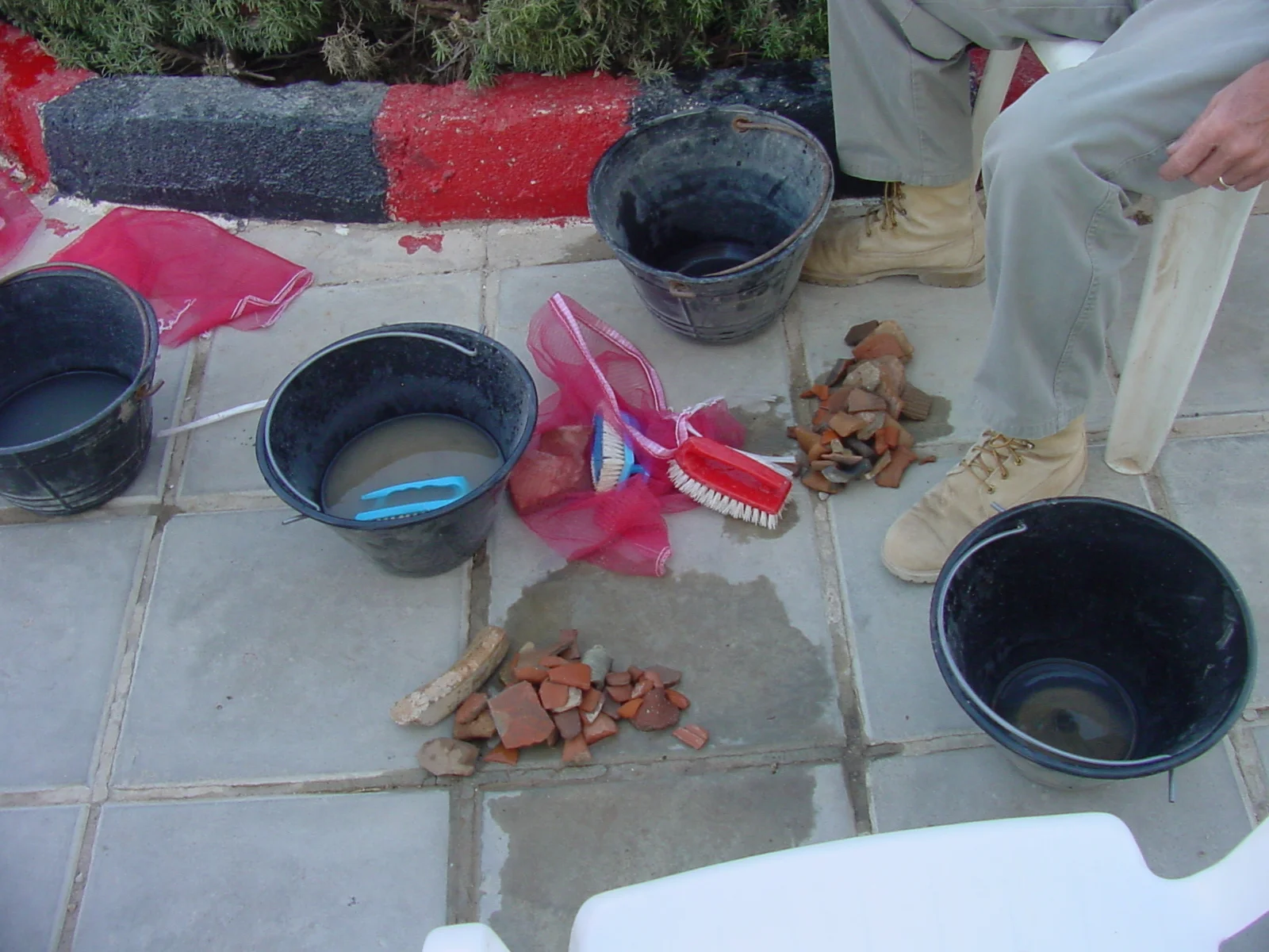   Pottery washed and then dried in mesh bags.  