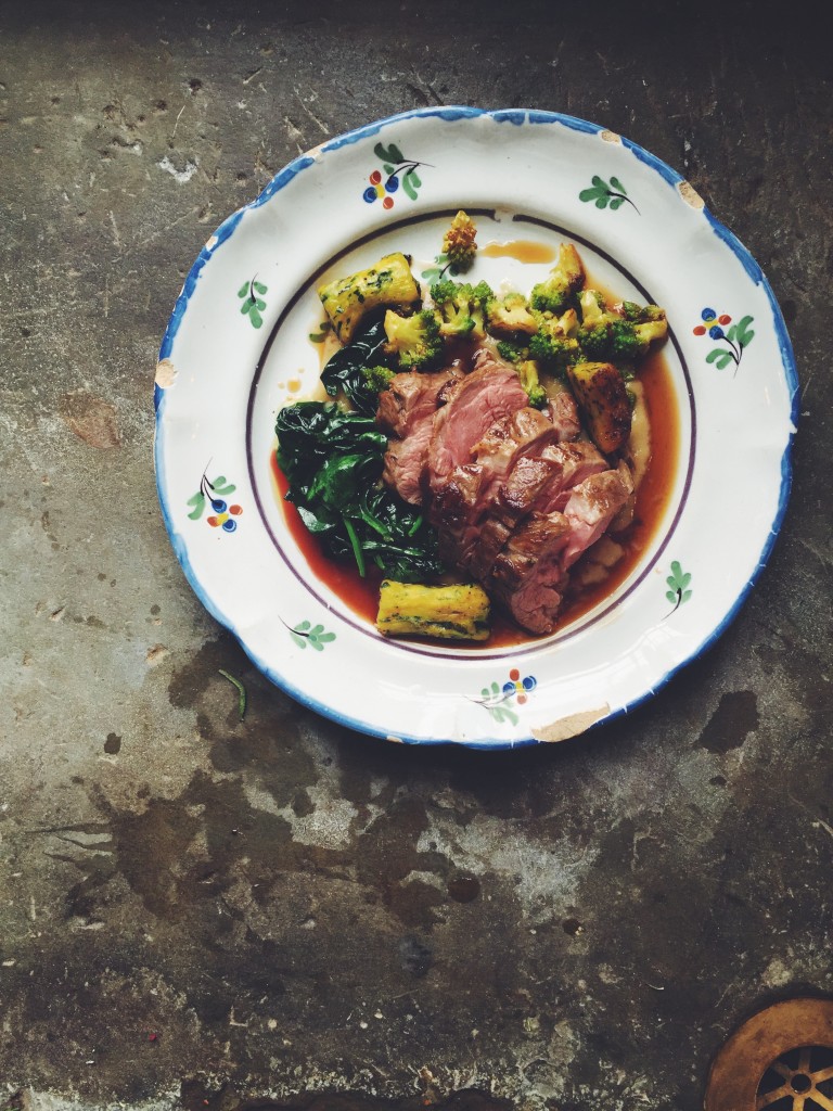 Spring lamb with wild garlic gnocchi wilted greens,cauliflower and roasted onion puree.