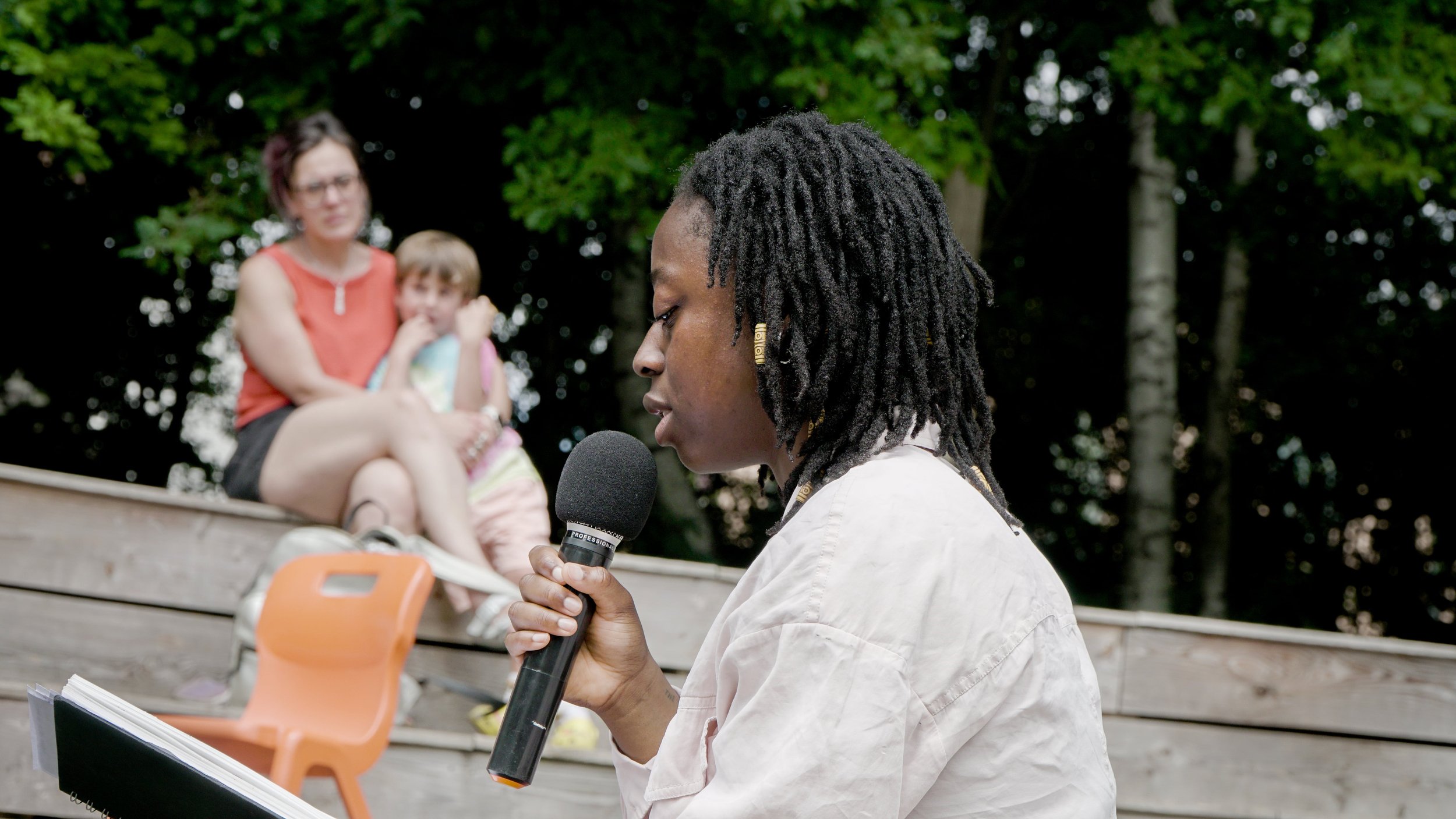 Leeza Awojobi poetry reading at Windmill City Farm, June 2025. Photo © Oliver Thistlewood, Crockshock Productions