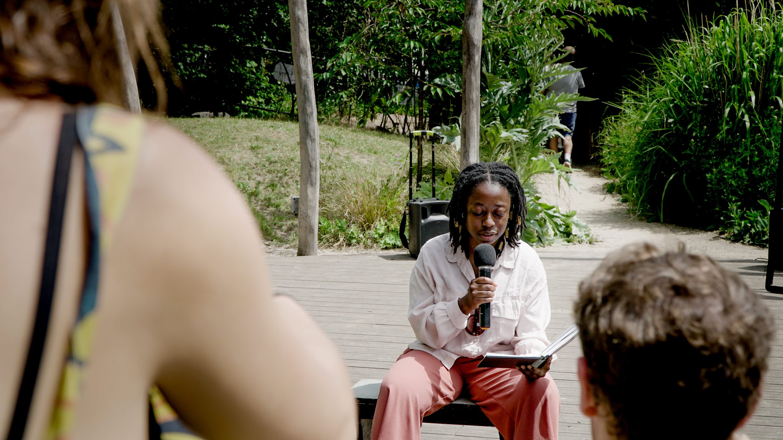 Leeza Awojobi poetry reading at Windmill City Farm, June 2025. Photo © Oliver Thistlewood, Crockshock Productions