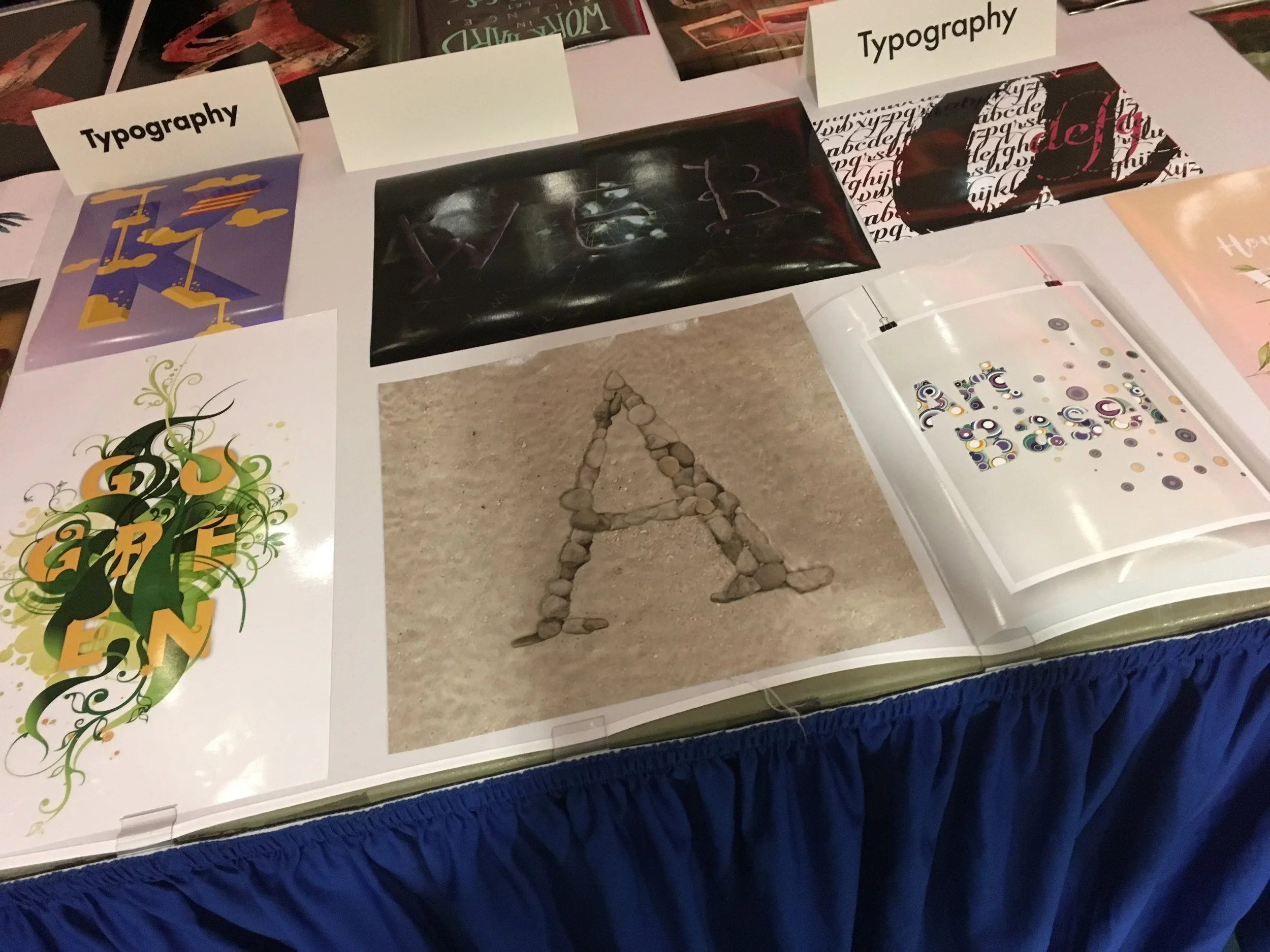 My project next to other really great works from other talented graphic design students