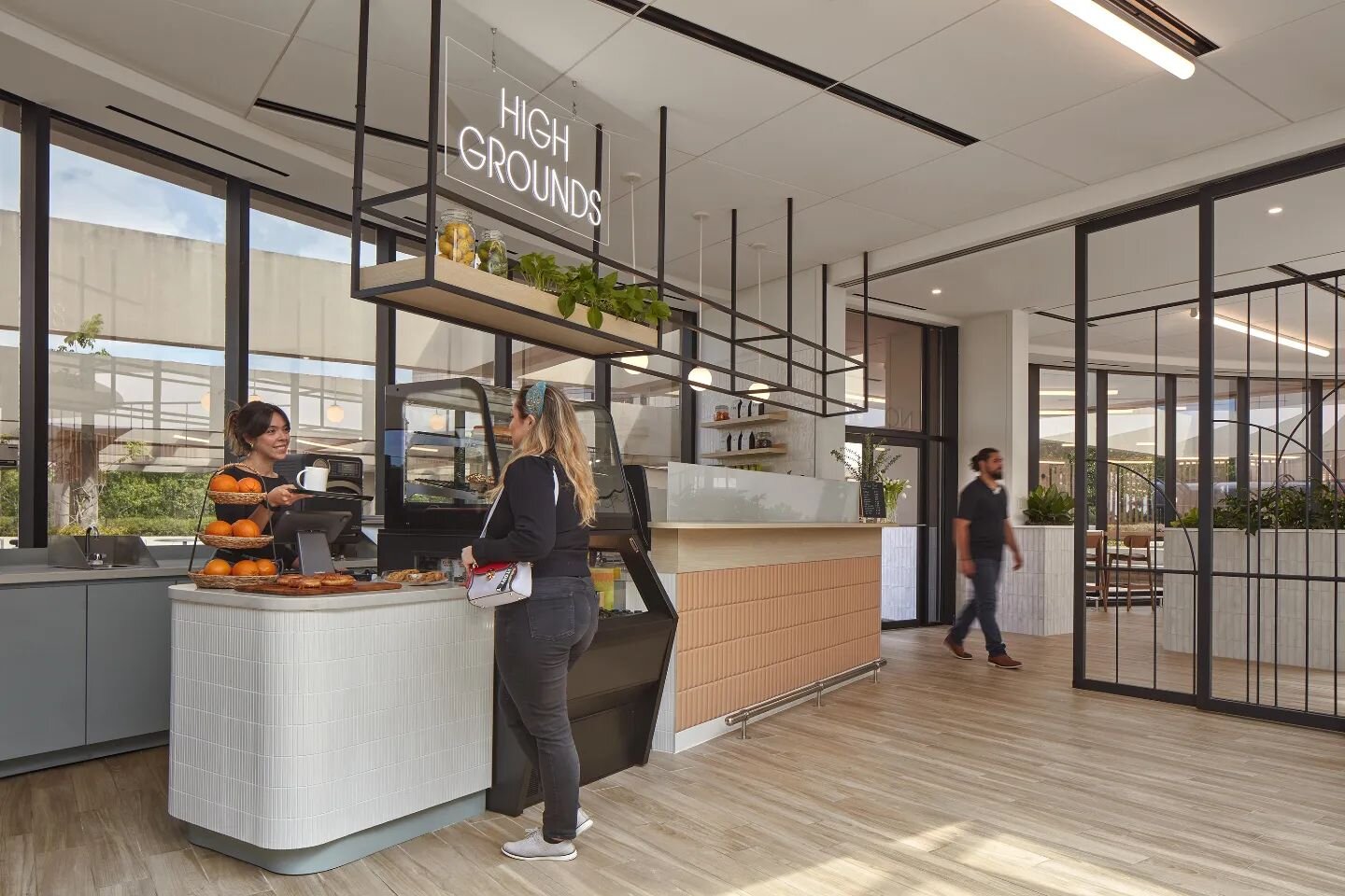 Take a look at @hospitalitysnapshots showcasing our Northpark Corporate Towers Cafe project! Our team integrates indoor and outdoor caf&eacute; seating with a contemporary commercial kitchen. Embracing a food hall approach, the area features three di