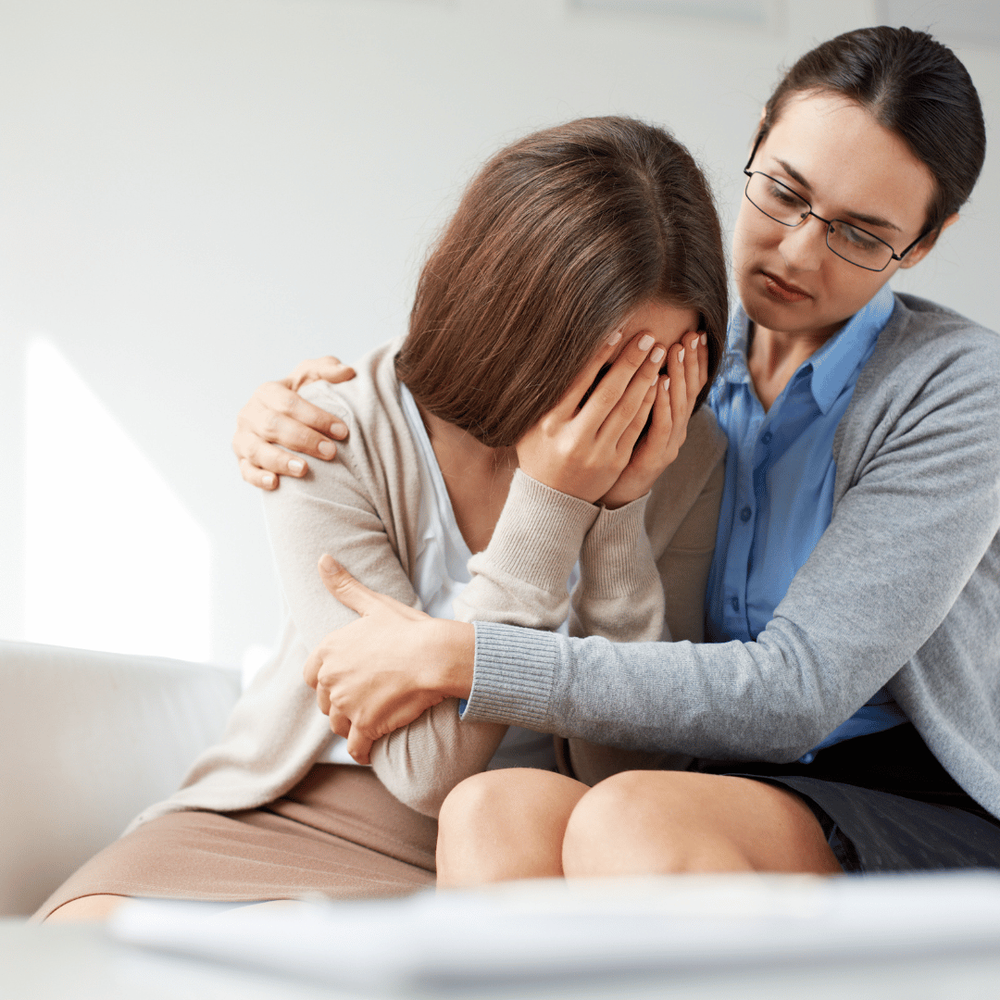 Girl crying in therapists arms | grief counseling in birmingham, al | grief counselor in birmingham, al | grief counseling in alabama | 35208 | 35209 | 35210