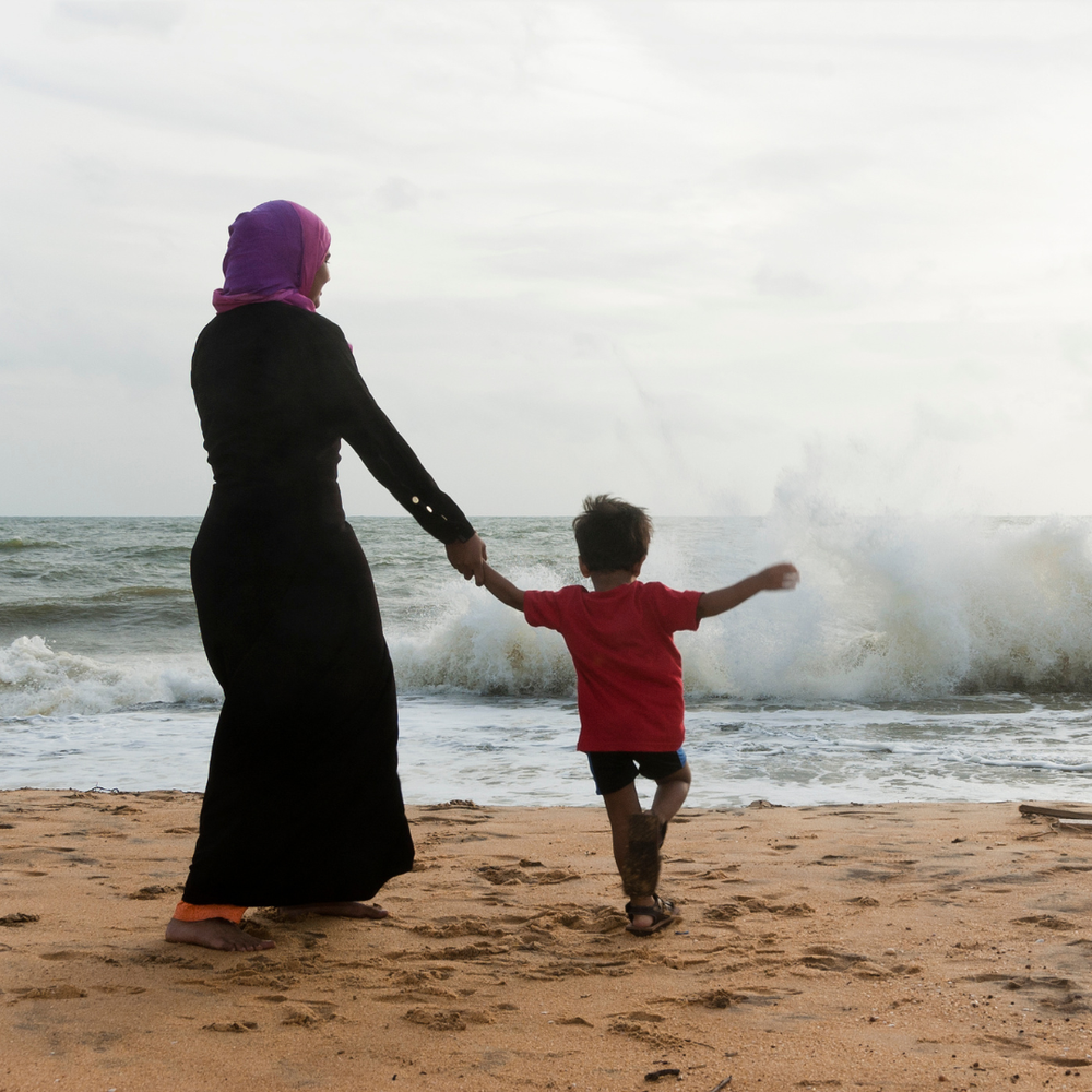 mother and son at ocean