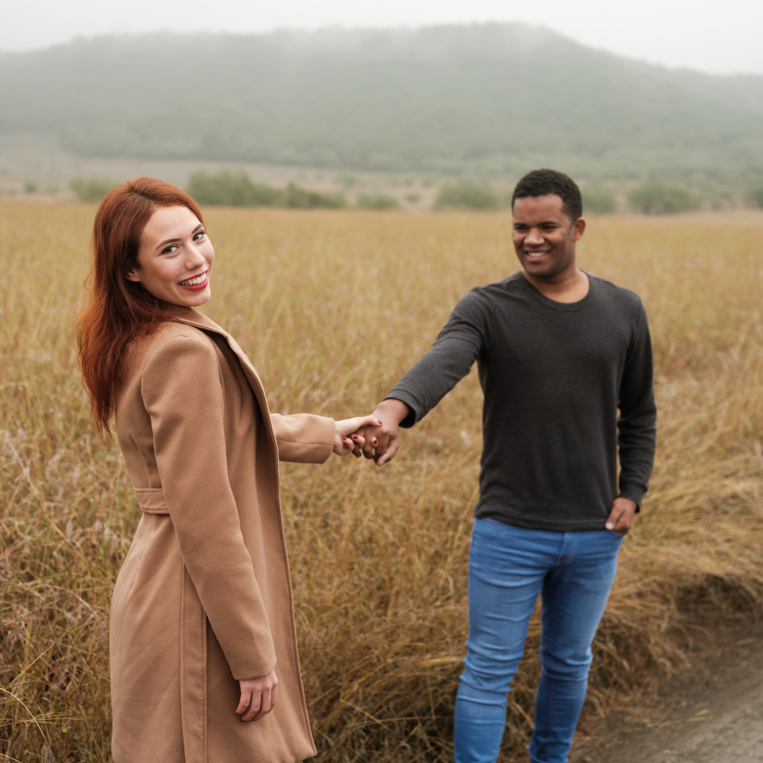 Couple holding hands in meadow I couples counseling intensive in birmingham, al | couples counseling intensive in alabama | 35208 | 35209 | 35210