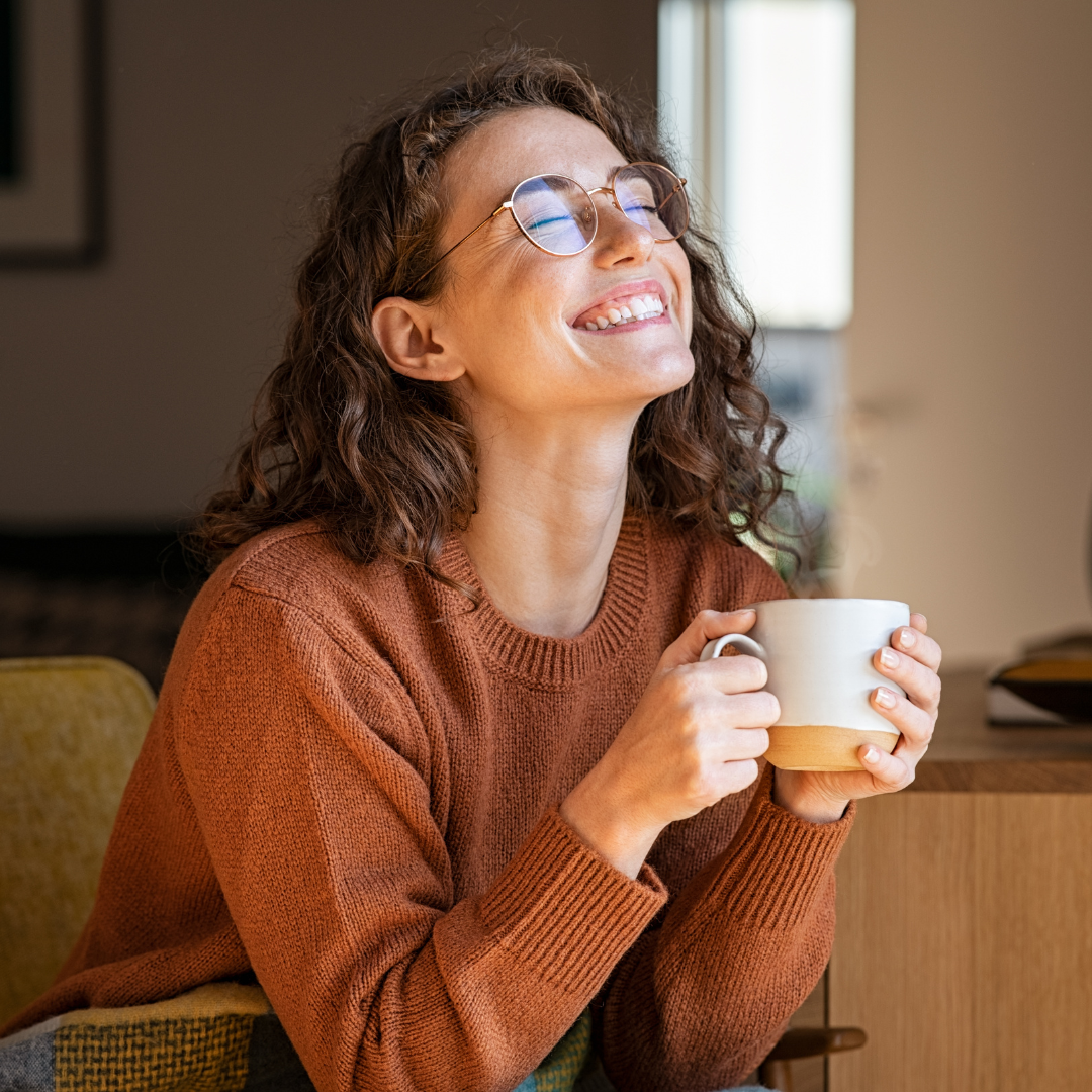 woman smiling with mug in hand I anxiety counseling in birmingham, al | anxiety counselor in birmingham, al | anxiety counseling in alabama | 35208 | 35209 | 35210
