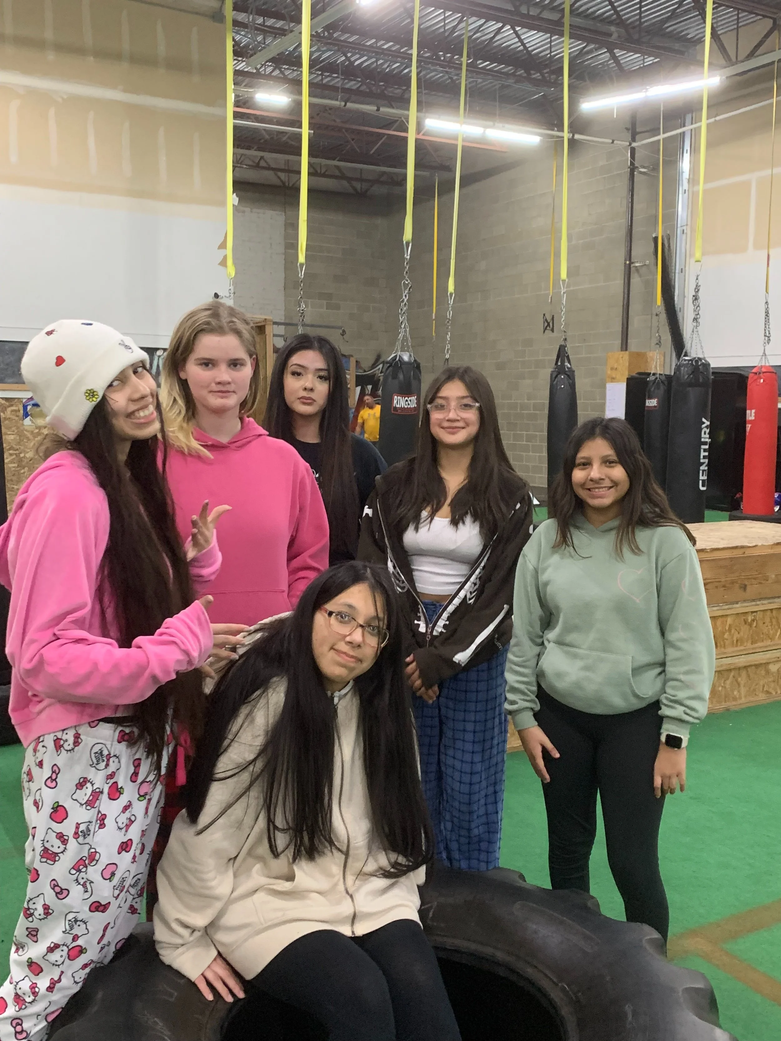 Scenic landscBuilt on Relevance, Rigor, and Relationshipsape of a mountain range with a lake in the foreground and grassy hills, under a cloudy sky.