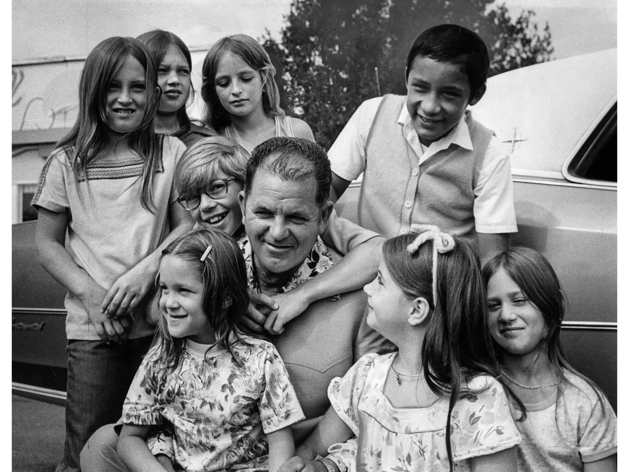 Ed Ray and some of the kids he saved (LA Times)