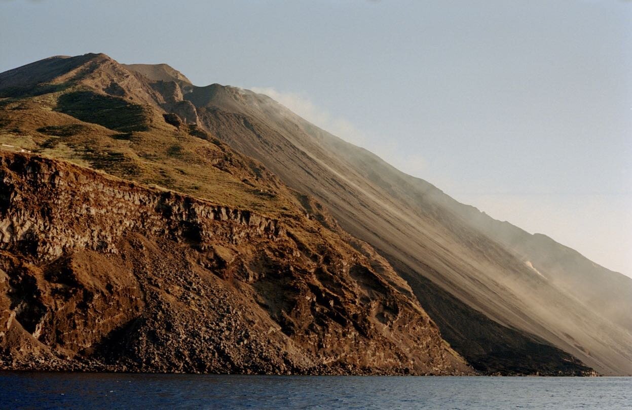 Under the mountain in the sea that draws breath, I found myself under hypnosis. My conscious overcome with clichéd tropes of man&rsquo;s insignificance. Uncomfortable yet soothing, anxiously awaiting a splutter of crimson rock, and hopefully nothing