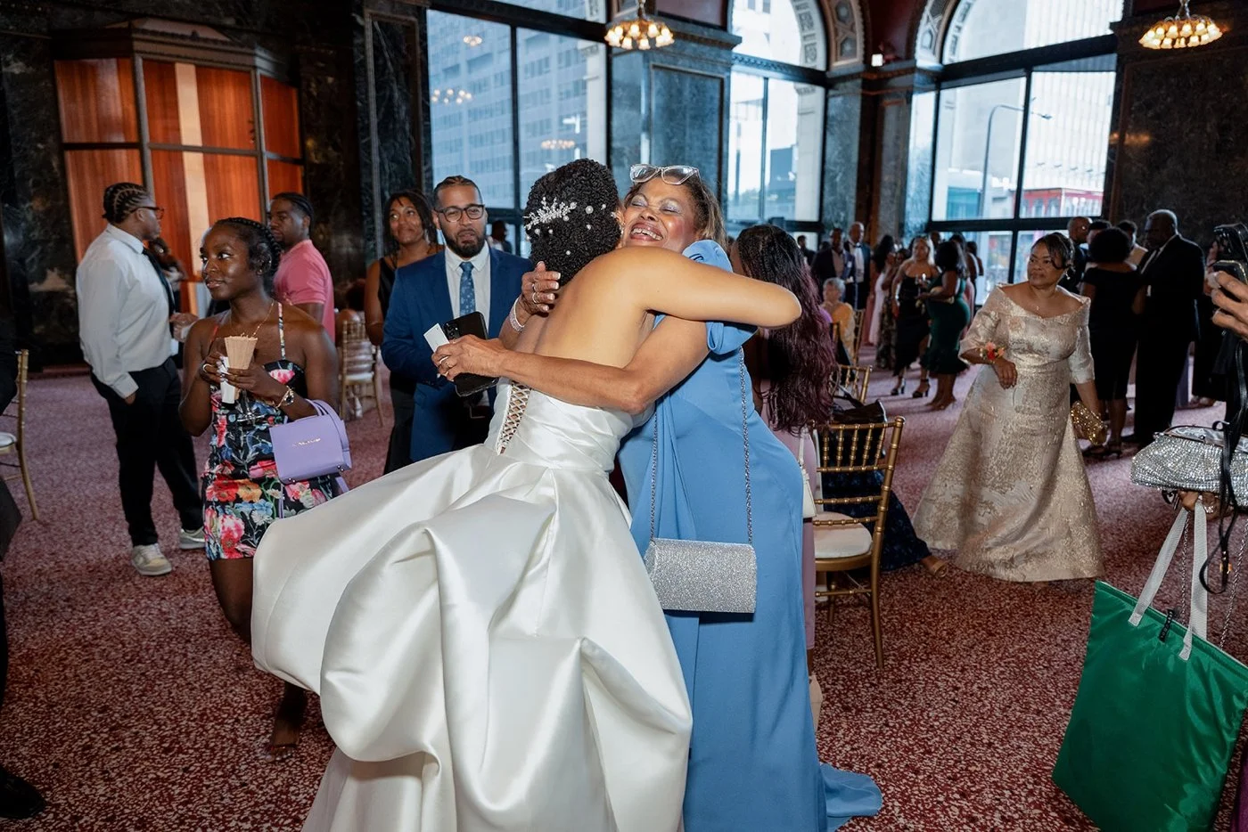Bride hugging one of her wedding guests