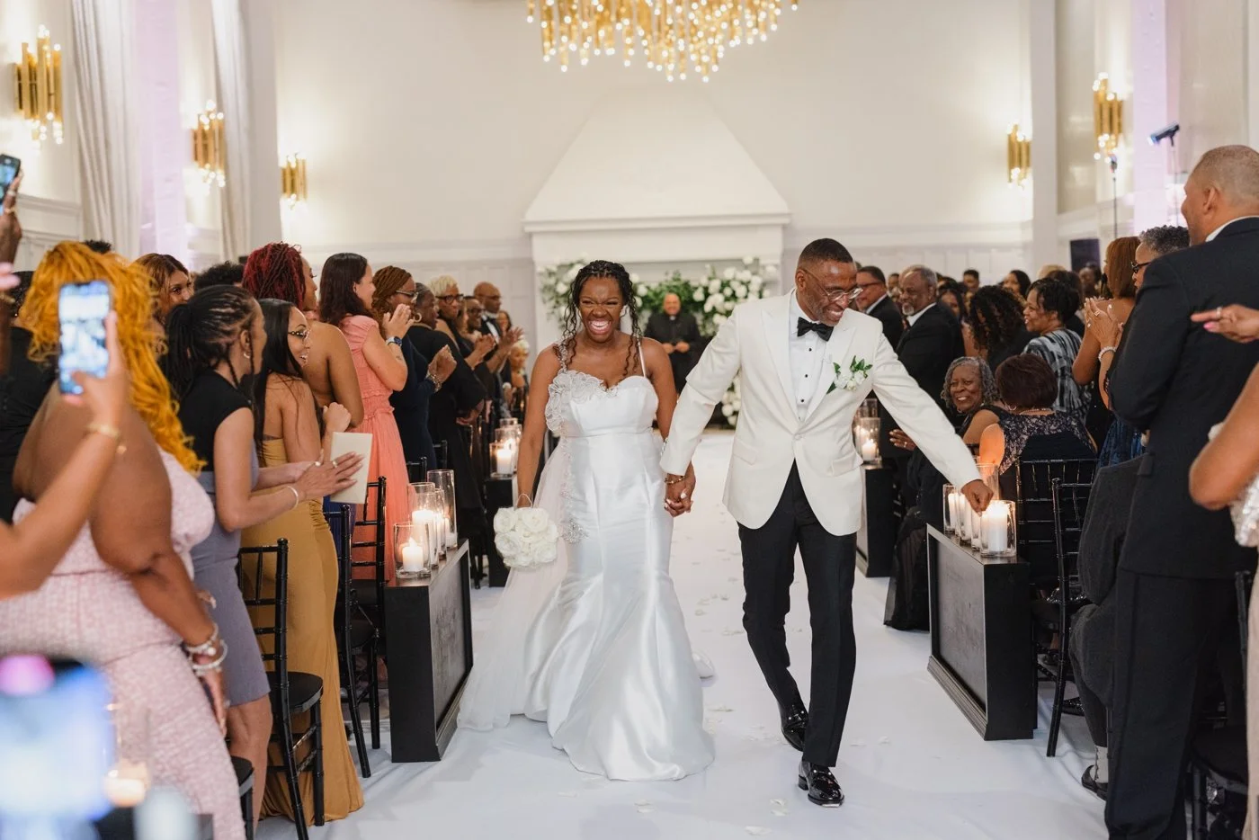 Bride and groom walking down the aisle after their Chicago wedding ceremony