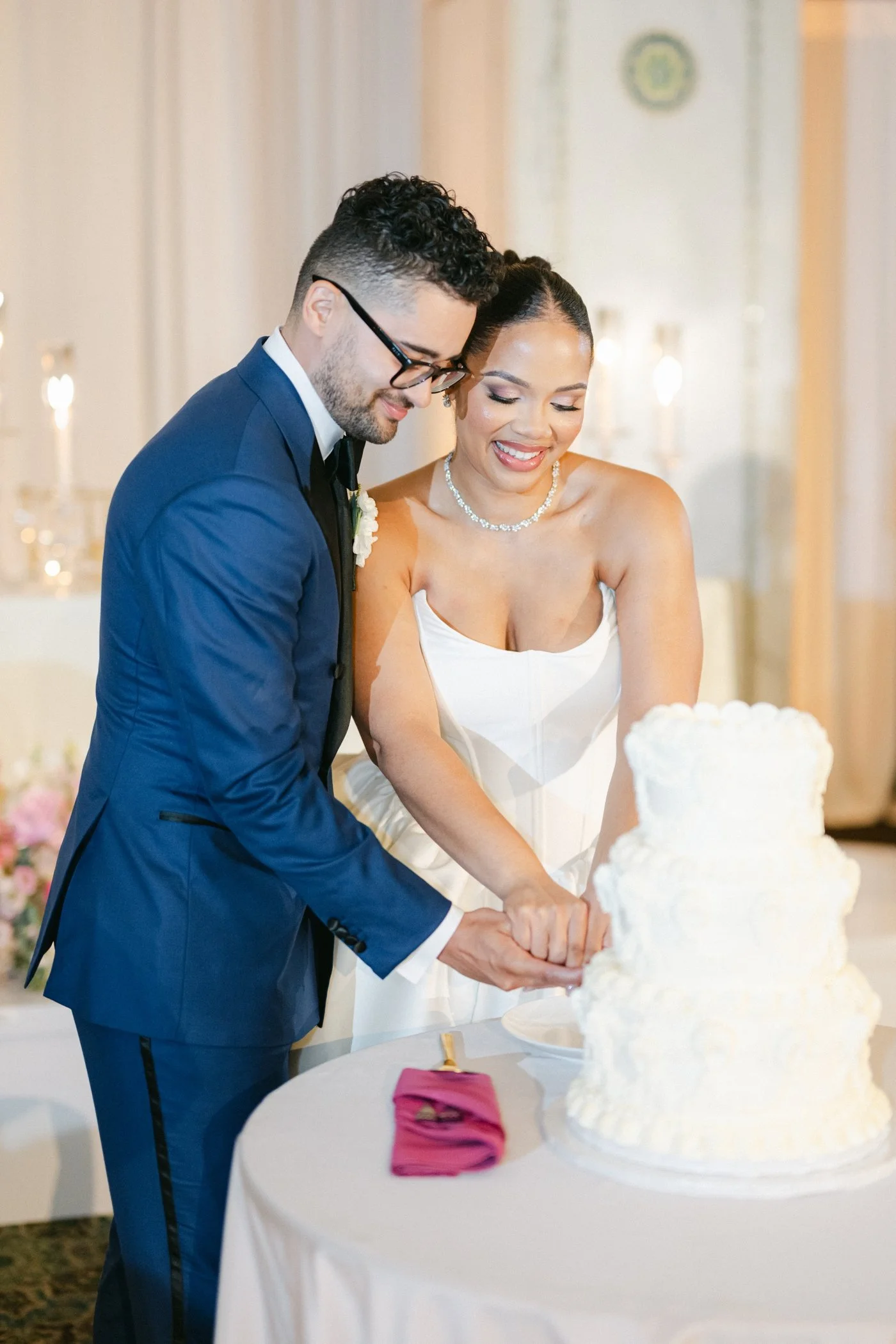 Bride and groom cutting their wedding cake