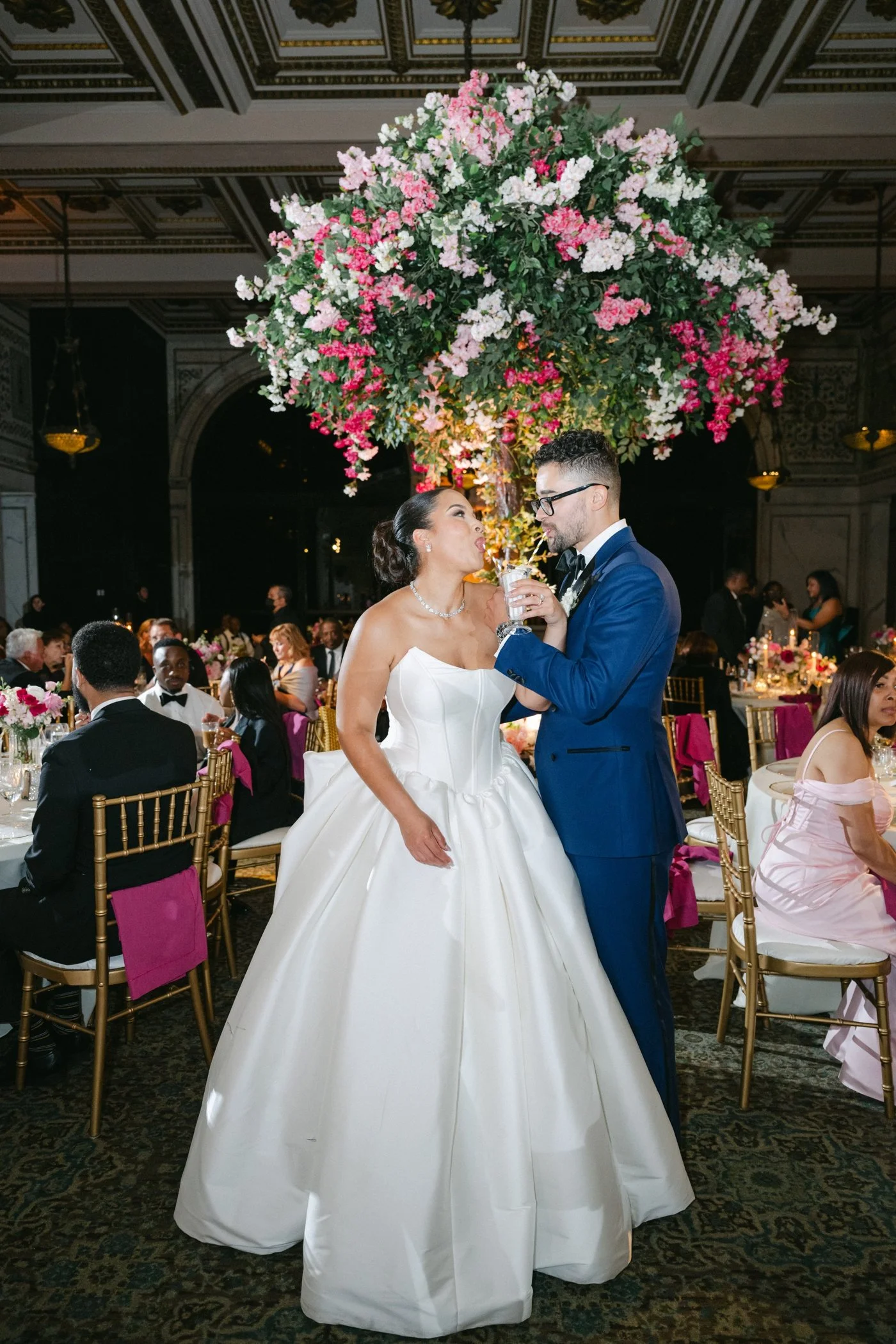 Bride and groom sharing a milkshake