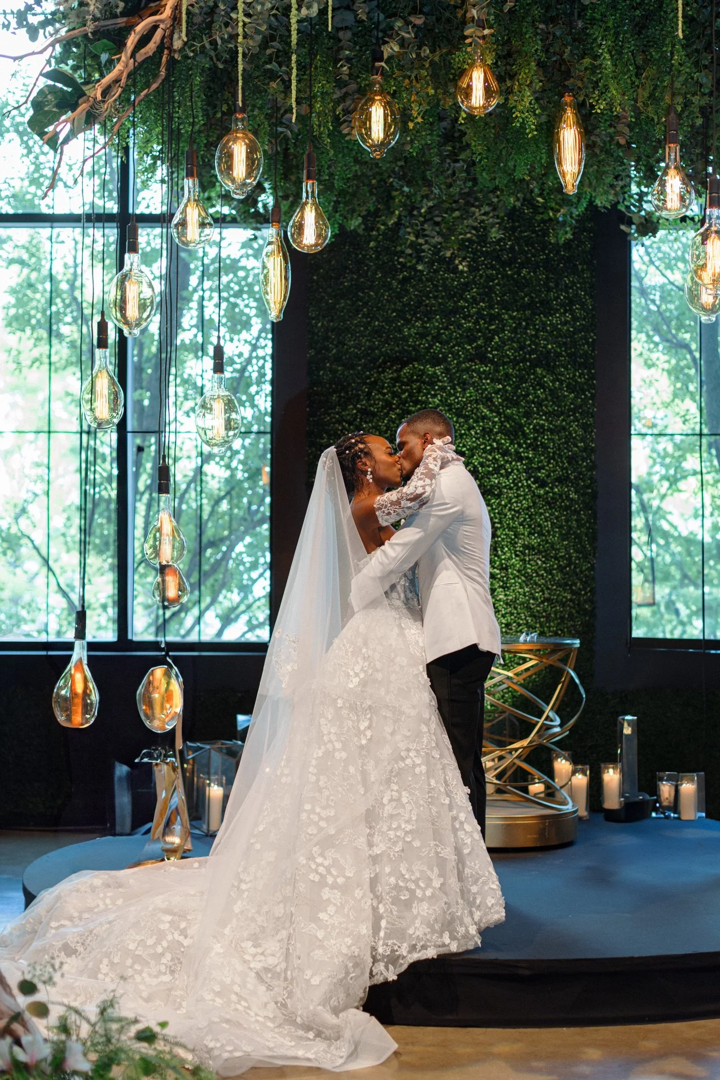 Bride and groom sharing their first married kiss