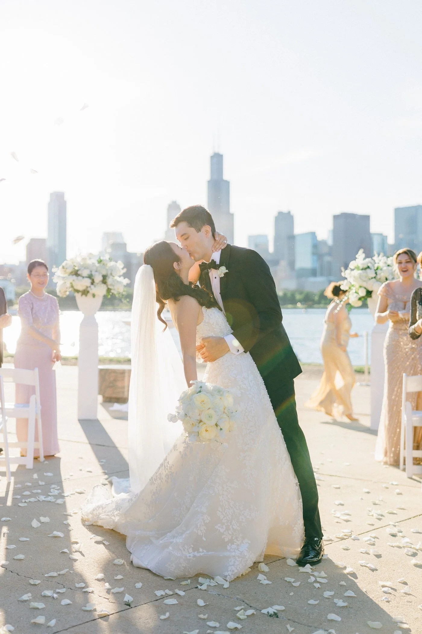 Groom kissing bride after their Adler Planetarium wedding ceremony