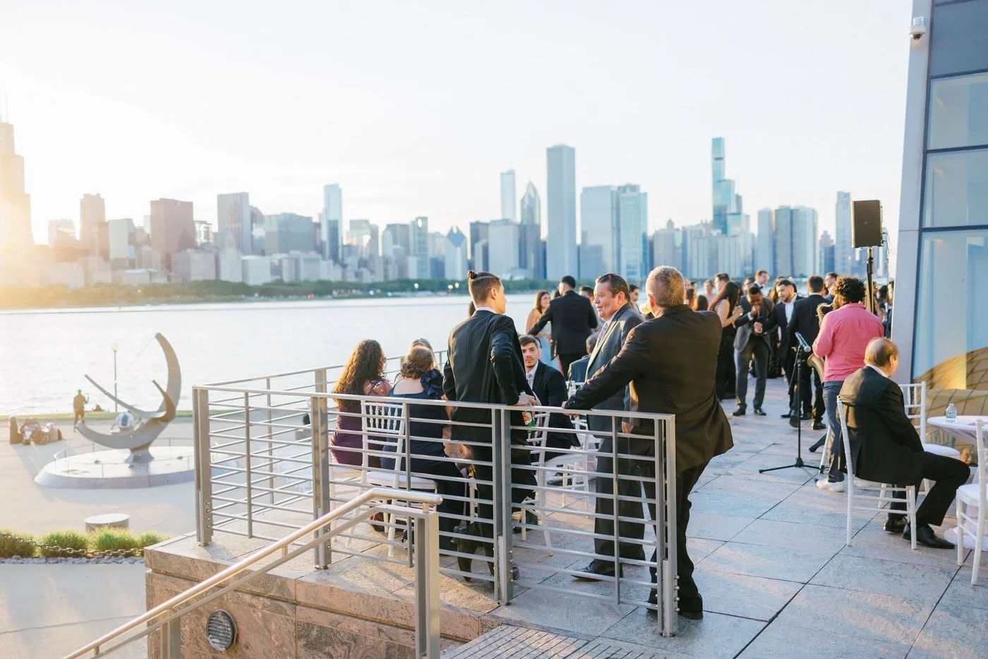 Guests at an Adler Planetarium wedding, balcony cocktail hour