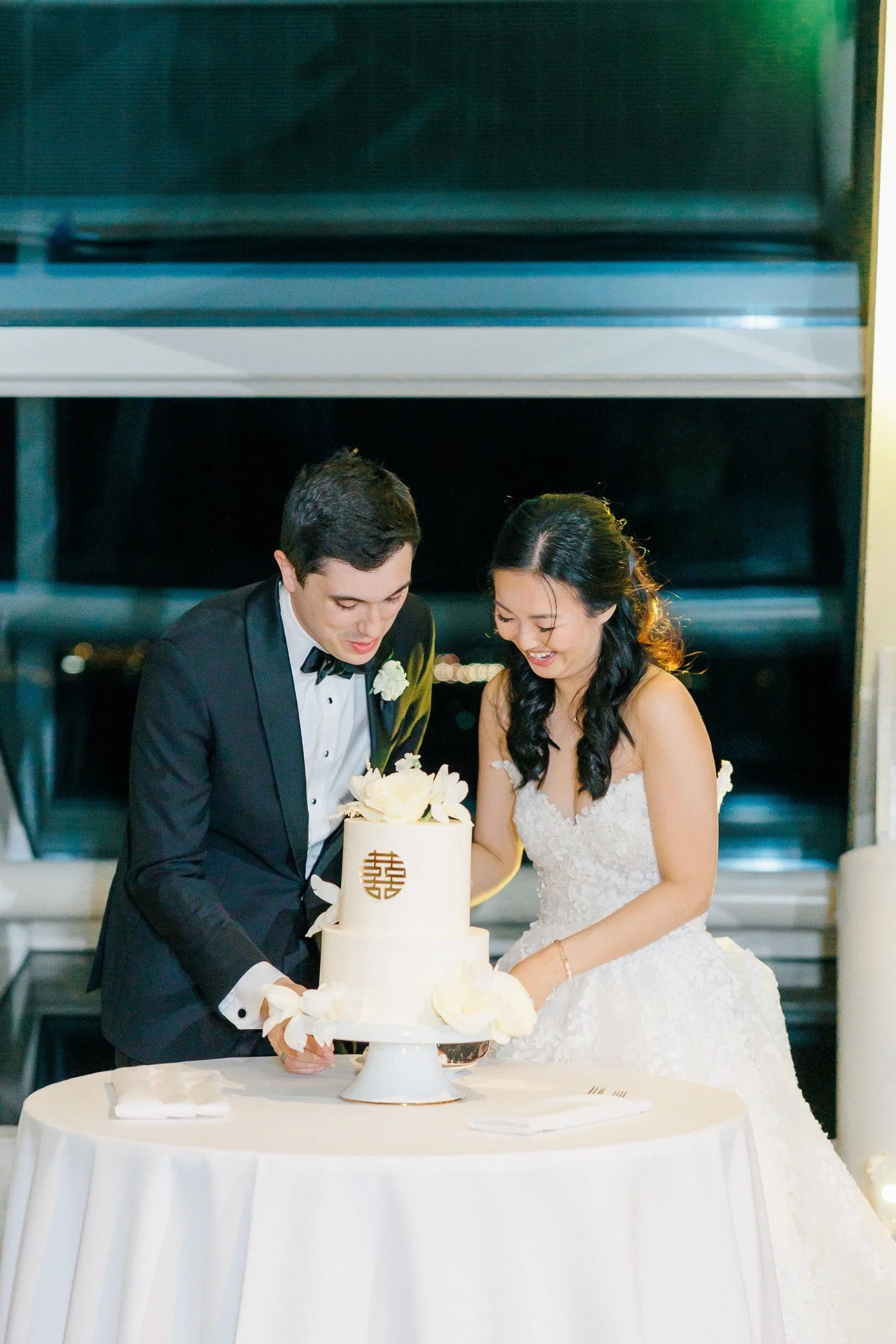 Bride and groom cutting their wedding cake