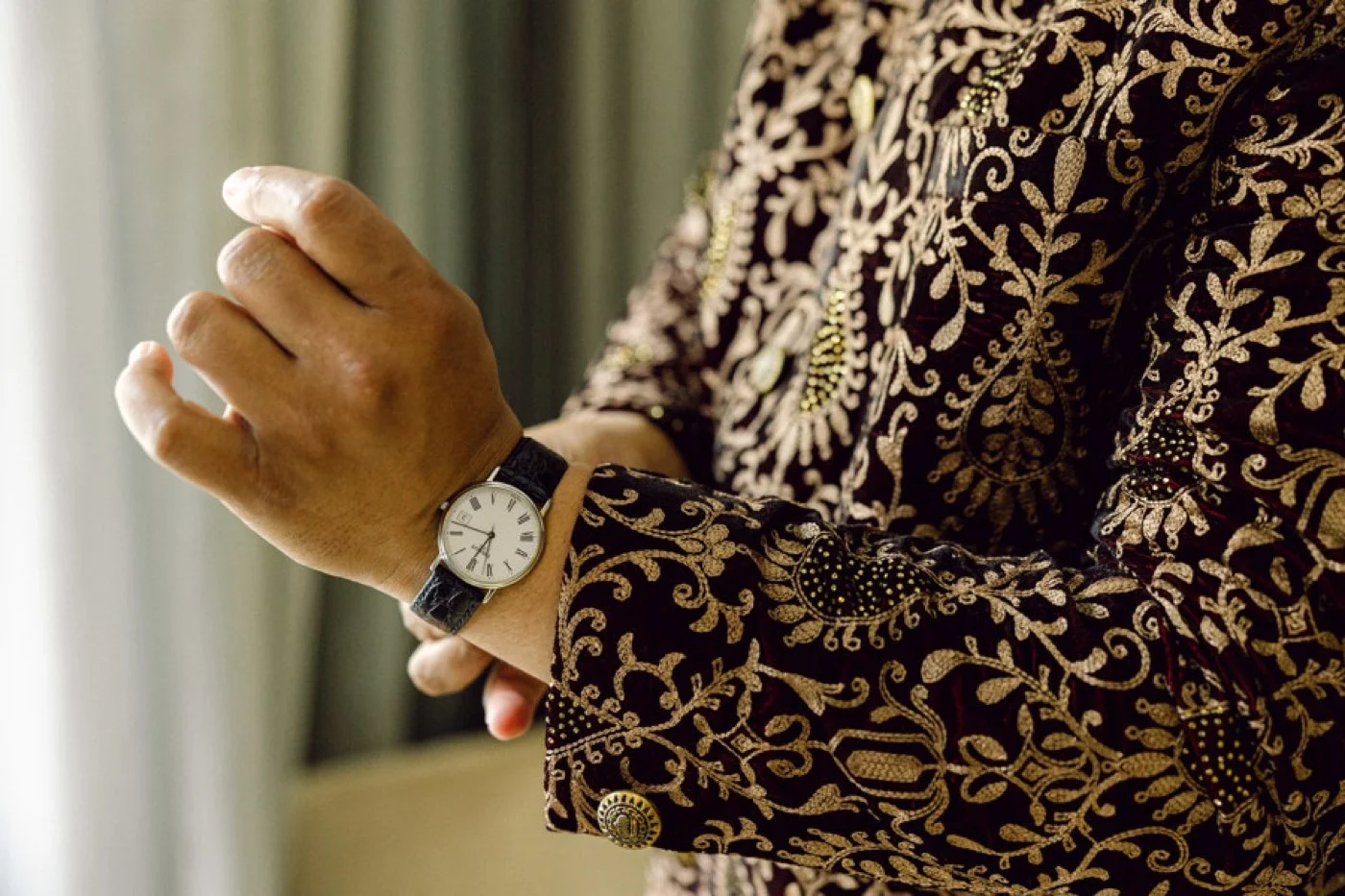 Groom putting on his watch