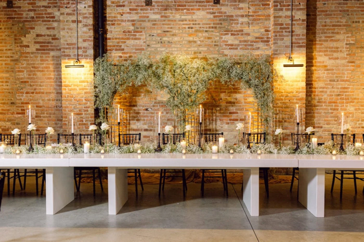 Head table with a repurposed baby's breath ceremony arch