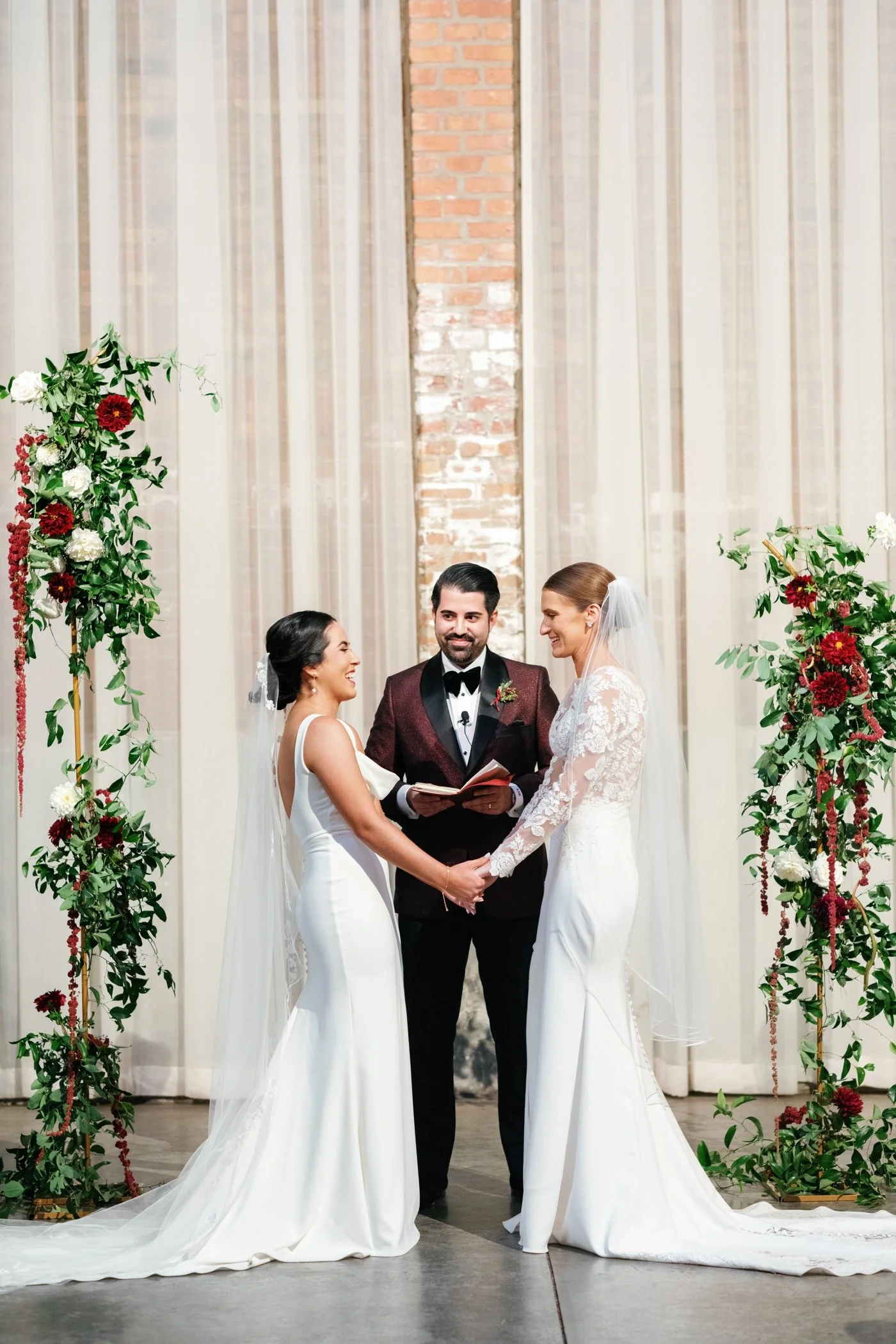 Brides laughing during their Chicago wedding ceremony