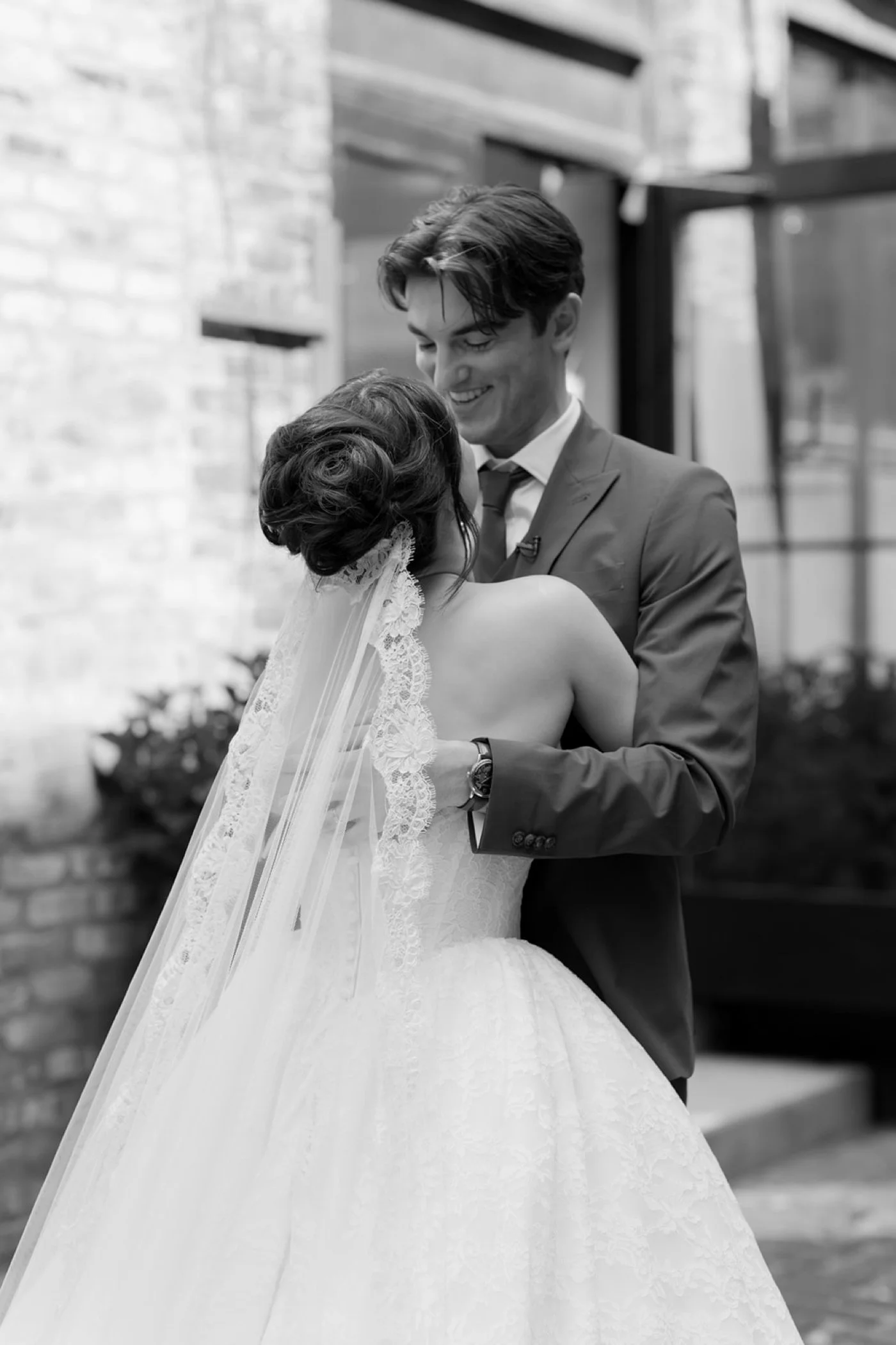 Bride and groom embracing after first look