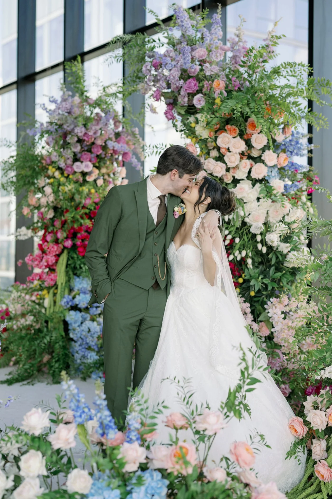 Bridal portrait at 167 Events in front of floral arch