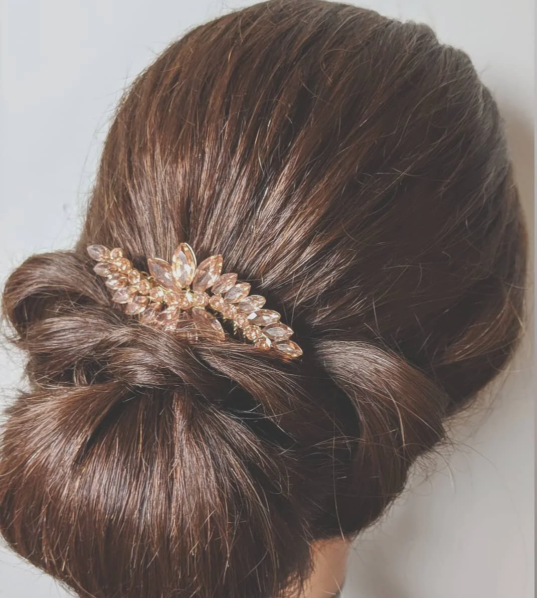 Modern chignon hairstyle By Rella 
