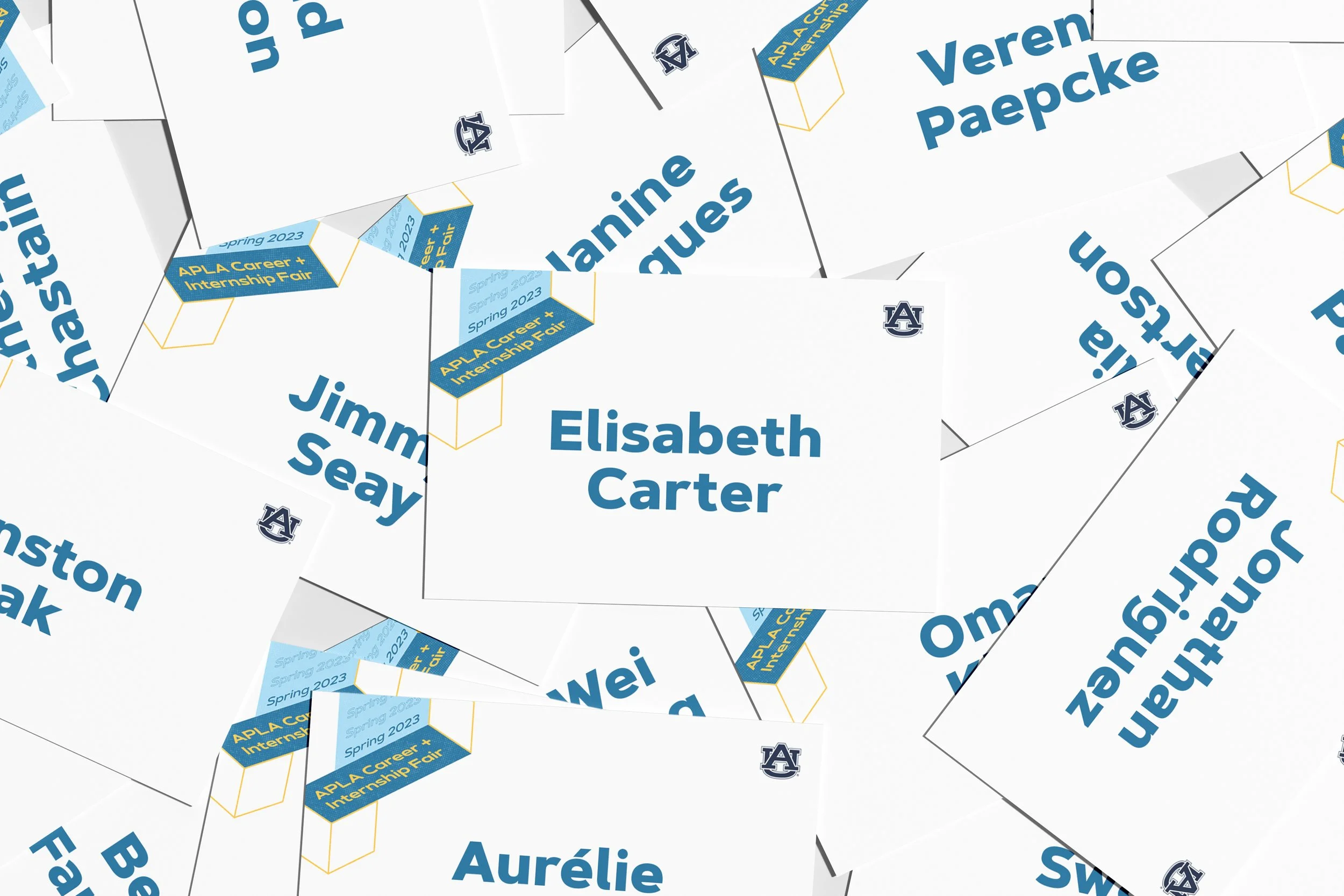   Name tags—produced for students and employers—utilized clear typography to support networking during the event. Elements of the event identity extended into the design to maintain visual cohesion across materials.  