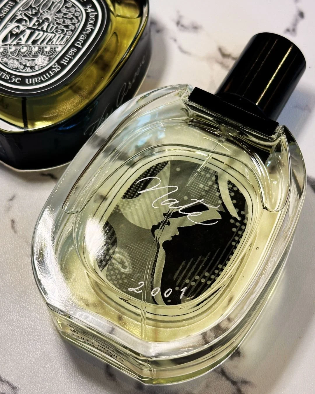 Calligraphy engraving on Diptyque perfume bottle at The Grove Los Angeles boutique