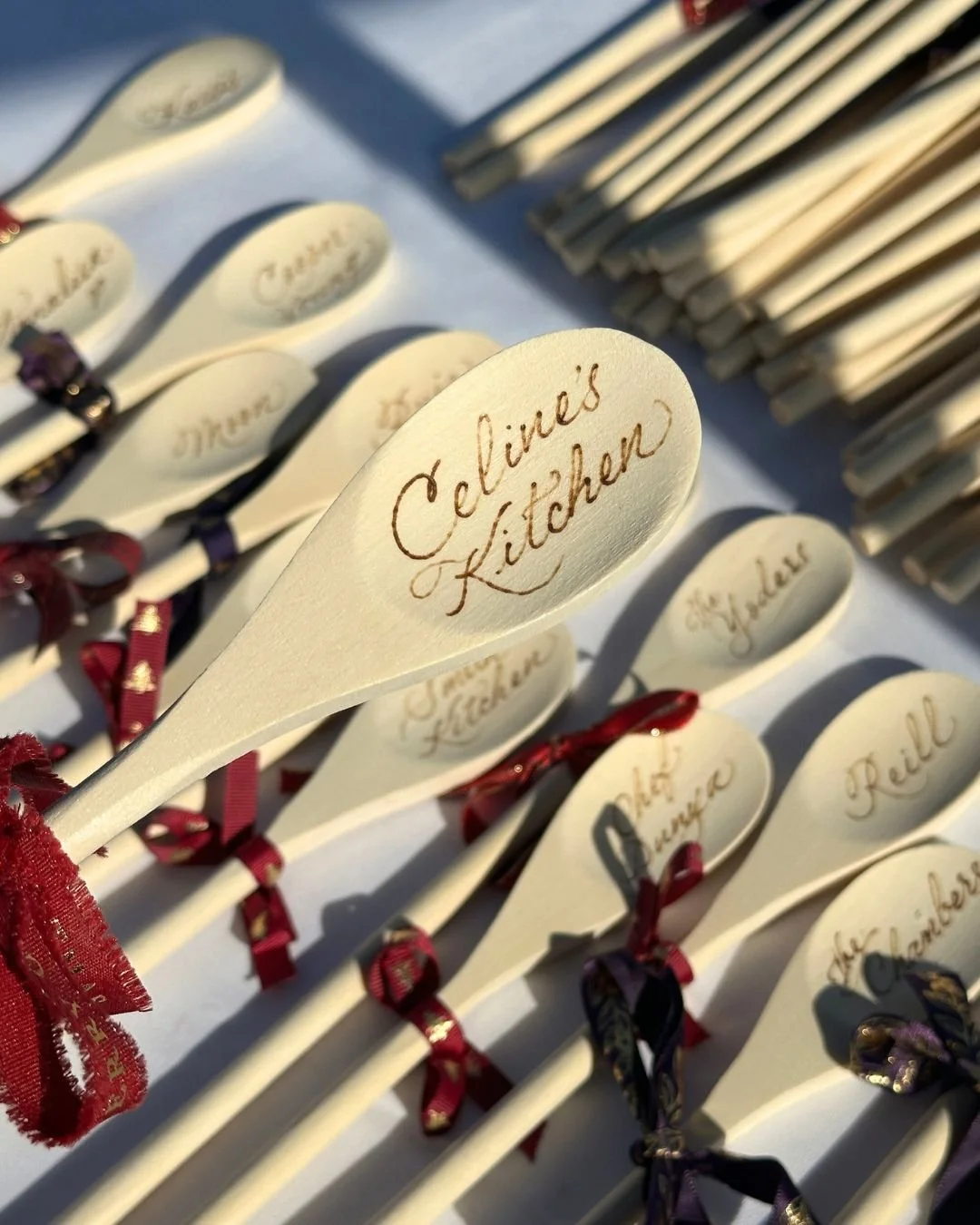 Souvenir spoons engraved by wood burning for corporate event in Orange County by calligraphy artist Hannah Choi