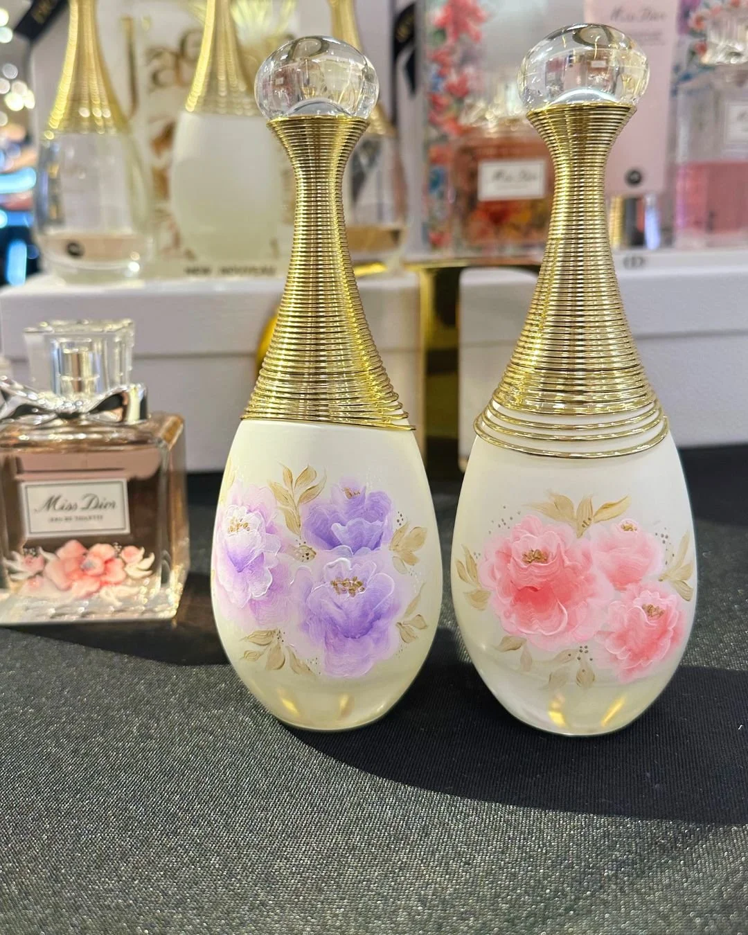 DIOR perfume bottles painted by live artist, Choi Calligraphy, at Brea Mall 