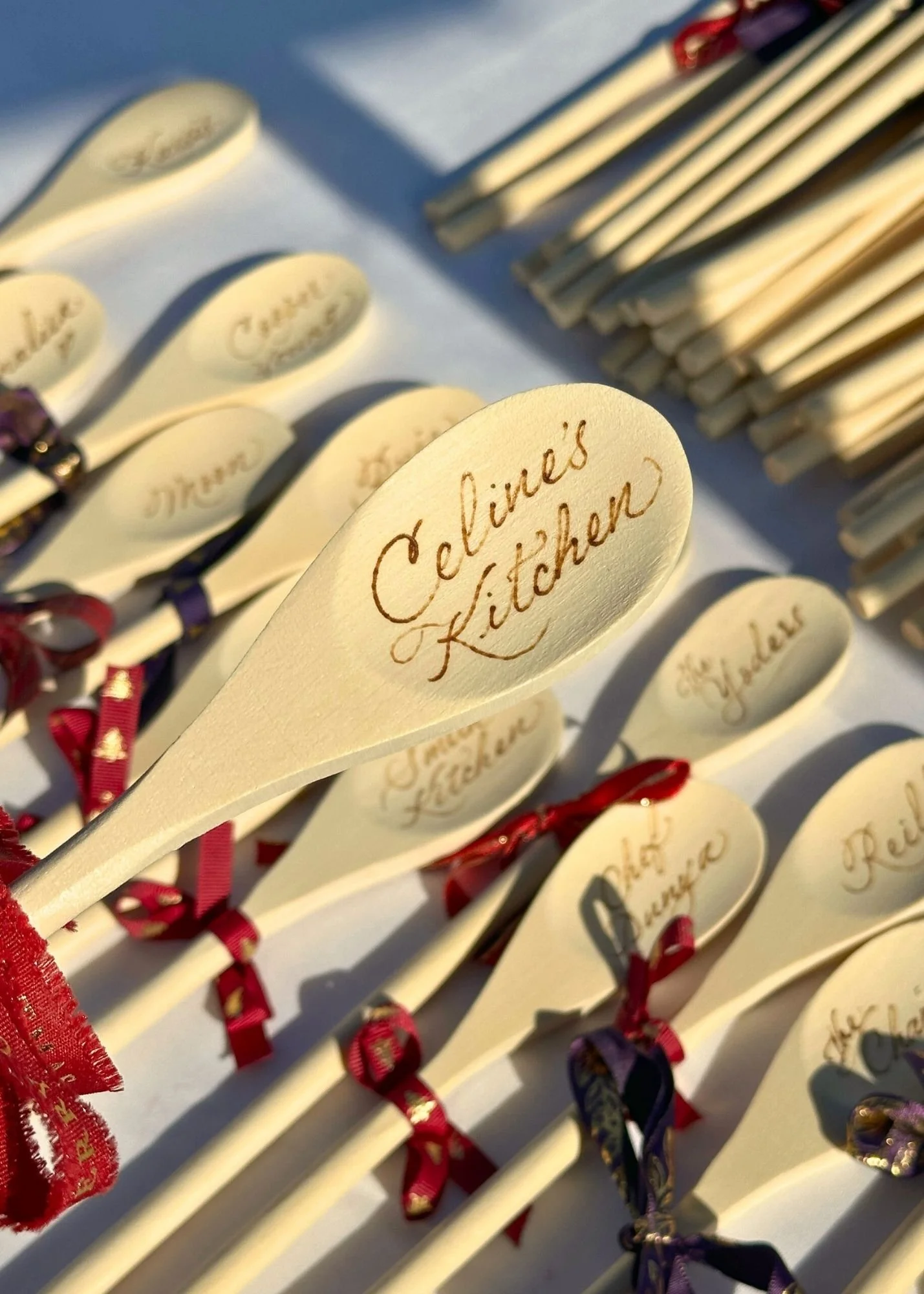 Wooden Spoon burning calligraphy at Orange County holiday party