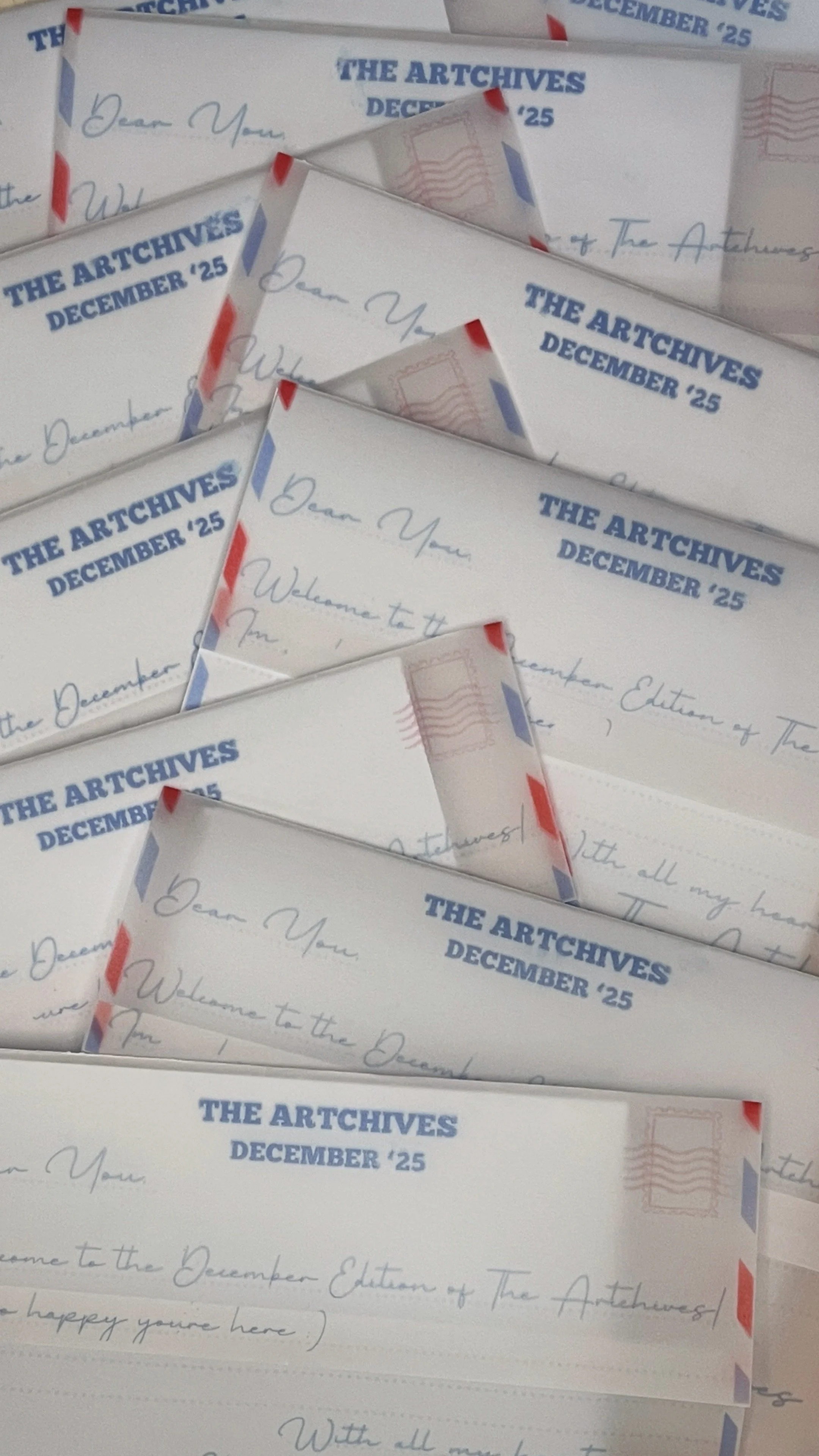 Several letters or postcards from 'The Archives' dated December 25, 2025, displayed in a layered arrangement.