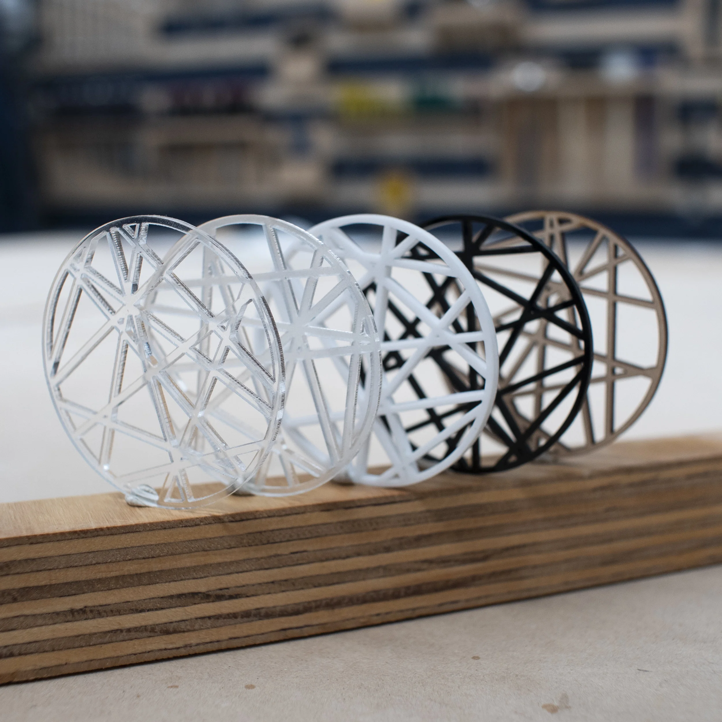 From left to right: Clear acrylic, Satin frosted acrylic, White acrylic, Black acrylic, 3mm mDF