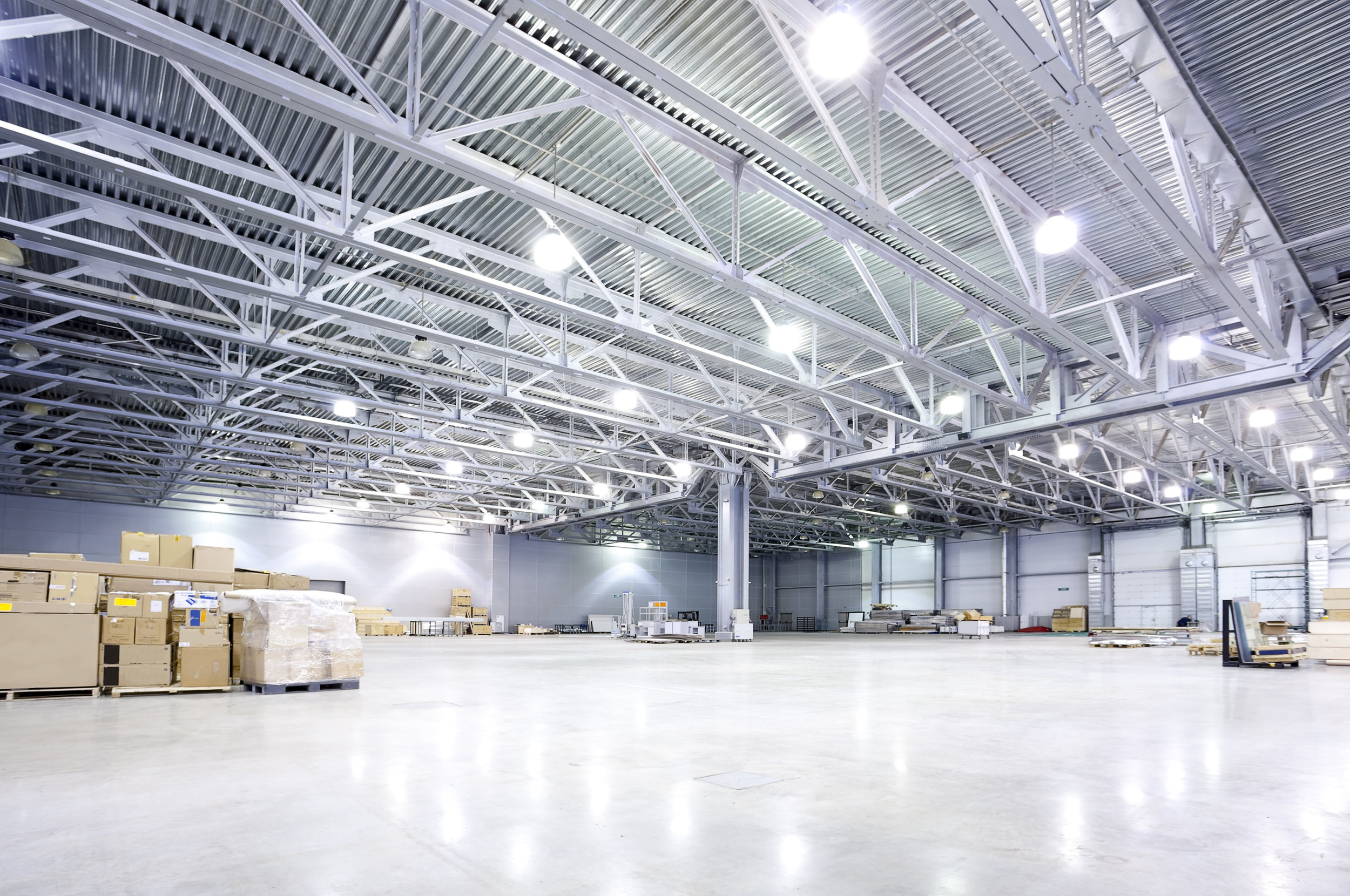 warehouse-LED-lighting-efficient-led-warehouse-lighting-a2a-solar-a2a-solar-empty-room-of-modern-storehouse-white-lighting-design-ideas.jpg