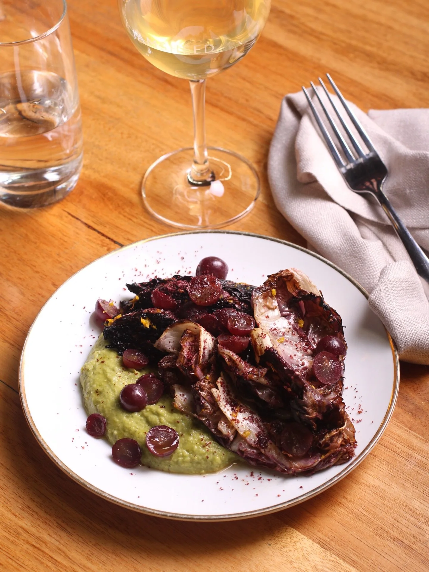Charred radicchio, pickled grapes, herbed haricot puree, sumac. Here all weekend!
