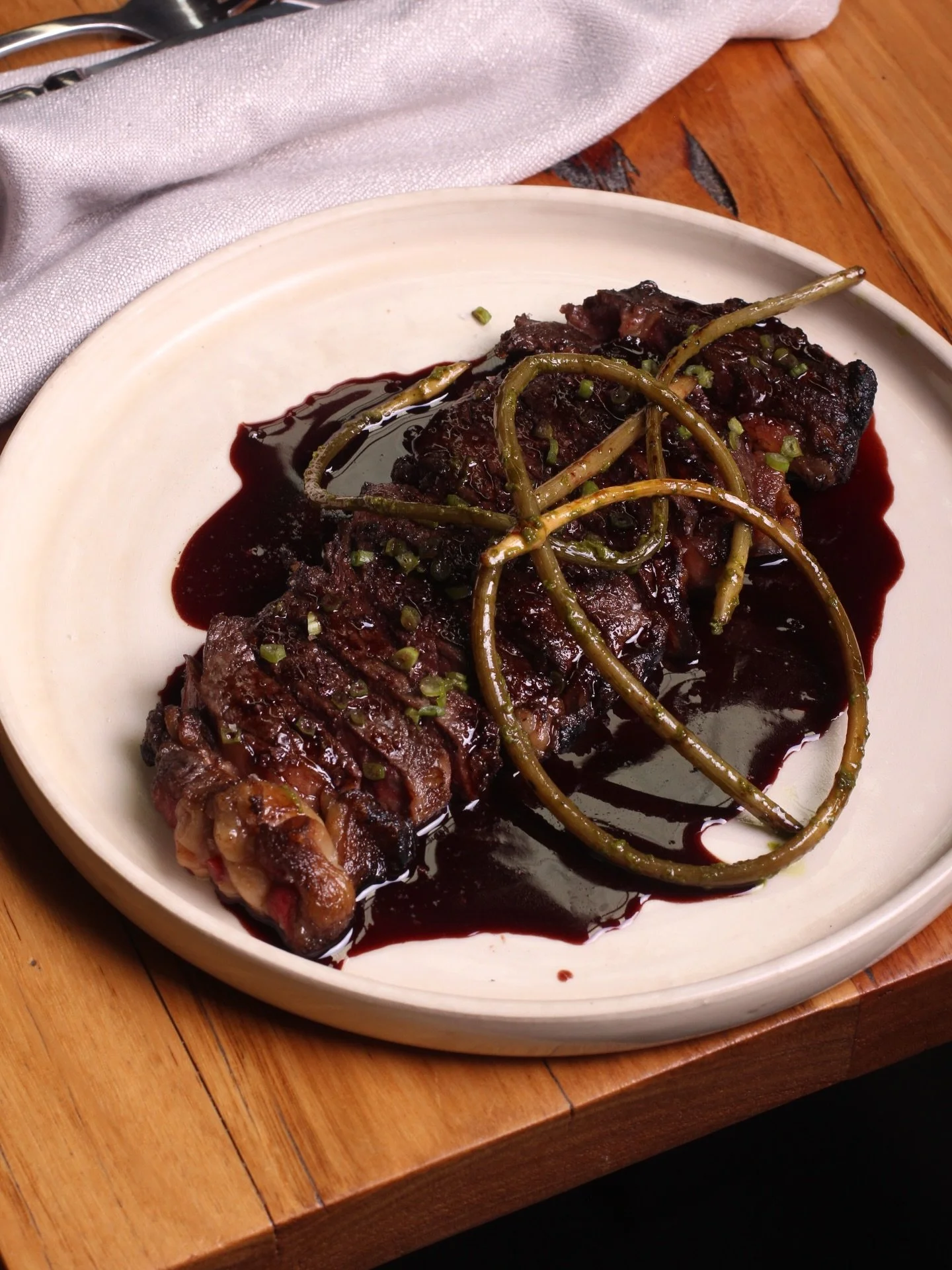 300g Sirloin cooked over fire, served with your choice of sauce; red wine jus made with Jamsheed Cabernet Sauvignon naturally (pictured!), salsa verde or a selection of mustards 🔥 Available Friday through Sunday.