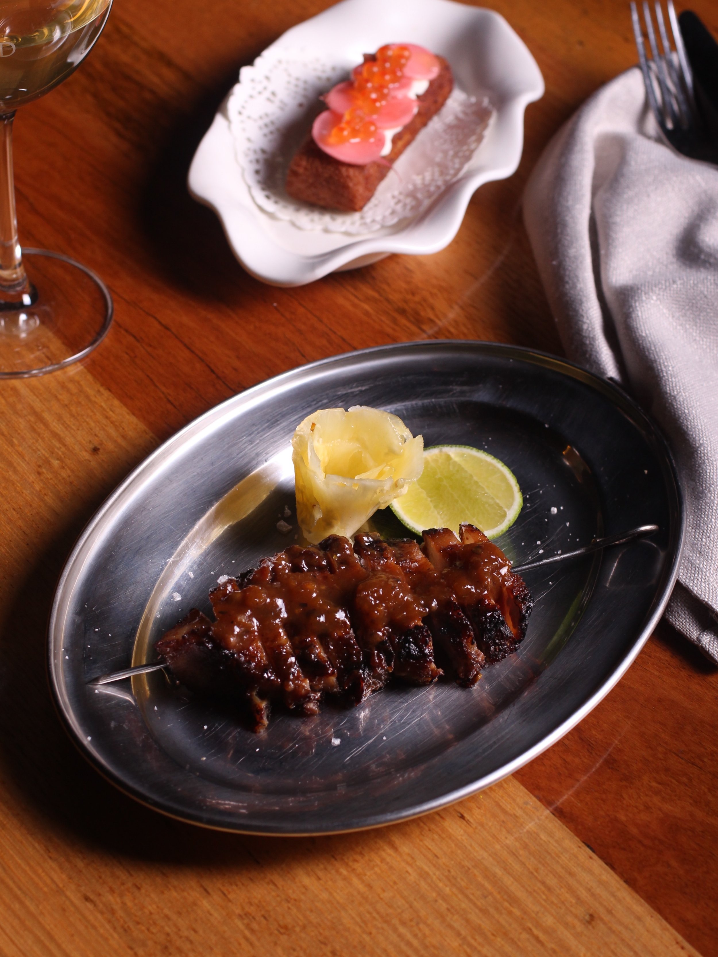 Pork jowl skewer with apricot glaze and pickled pineapple. She&rsquo;s small but mighty!