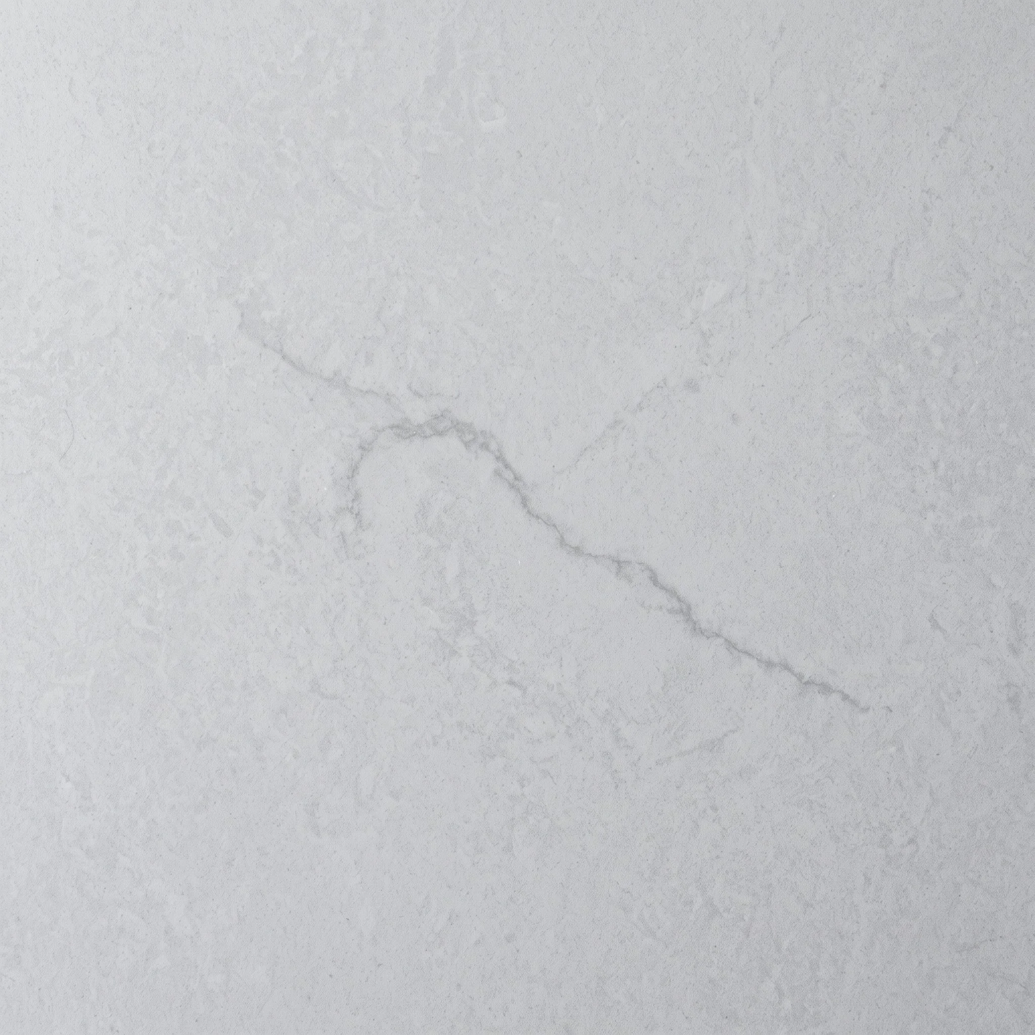 Empty white marble countertop with subtle gray veining.
