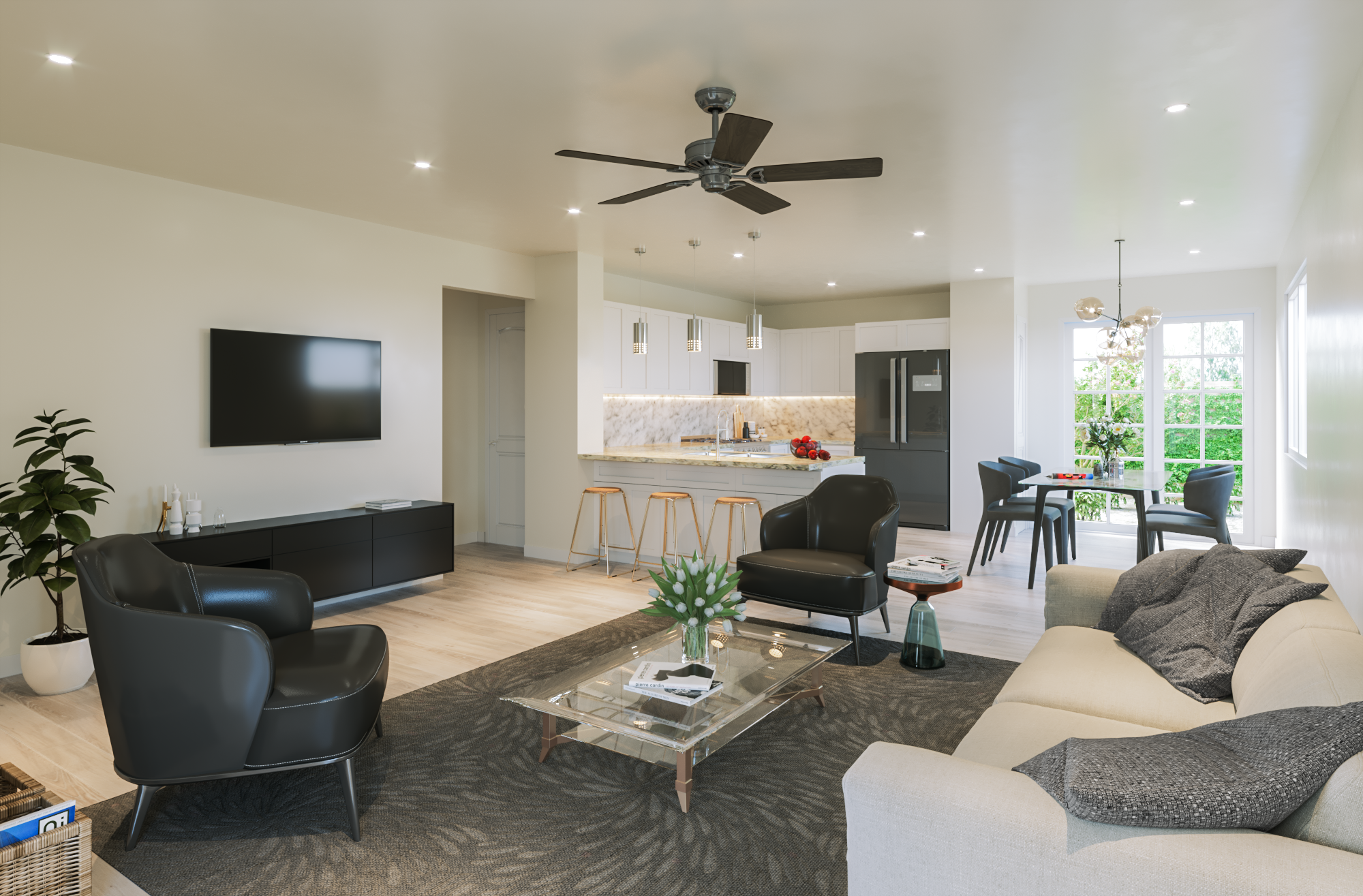 Open-concept living room and kitchen with white walls, a ceiling fan, black and beige furniture, and a large window with green trees outside.