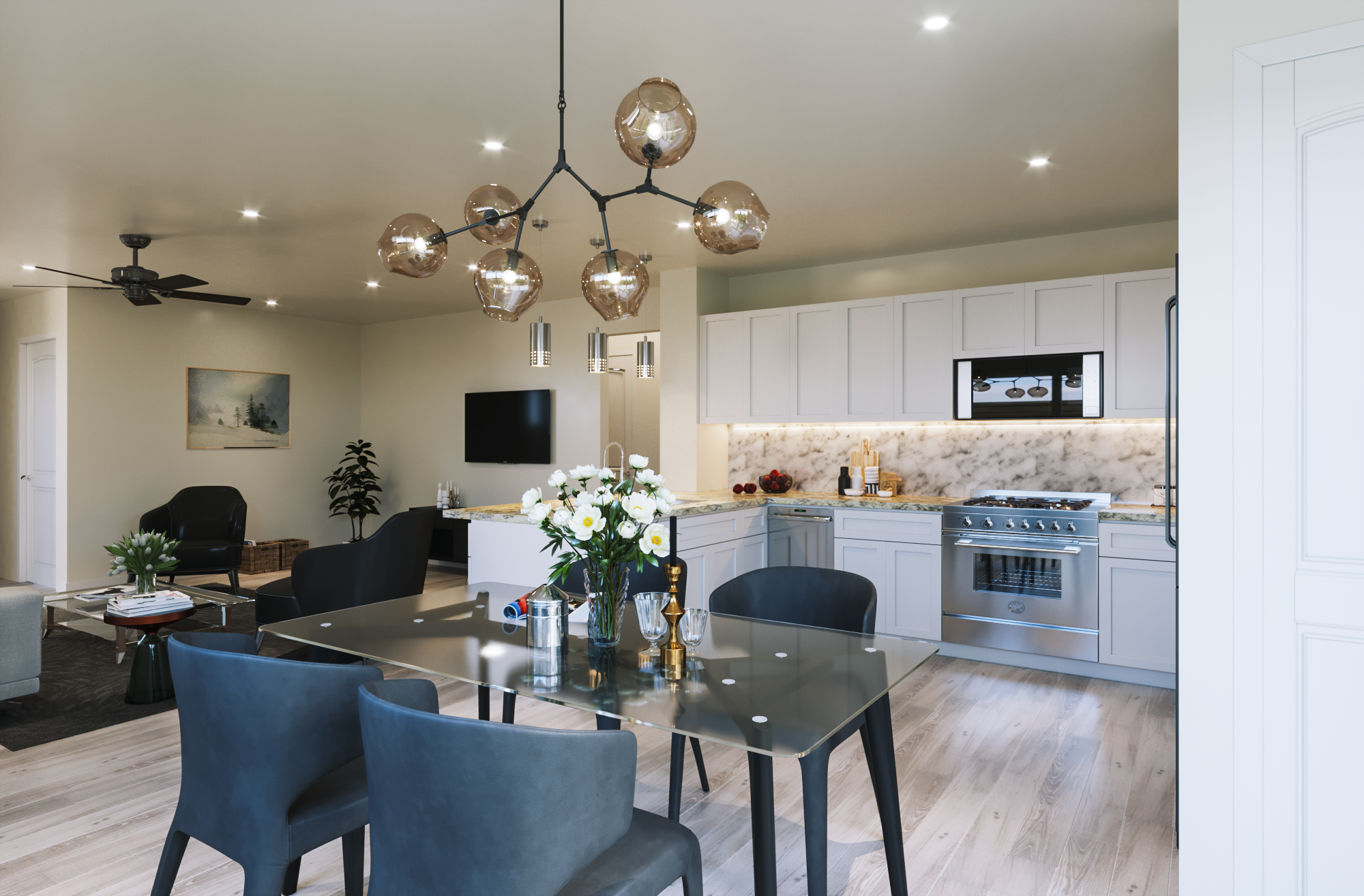 Modern kitchen and dining area with black chairs, a glass table, floral centerpiece, white cabinetry, and a stainless steel stove and microwave. There are decorative pendant lights and ceiling fans.