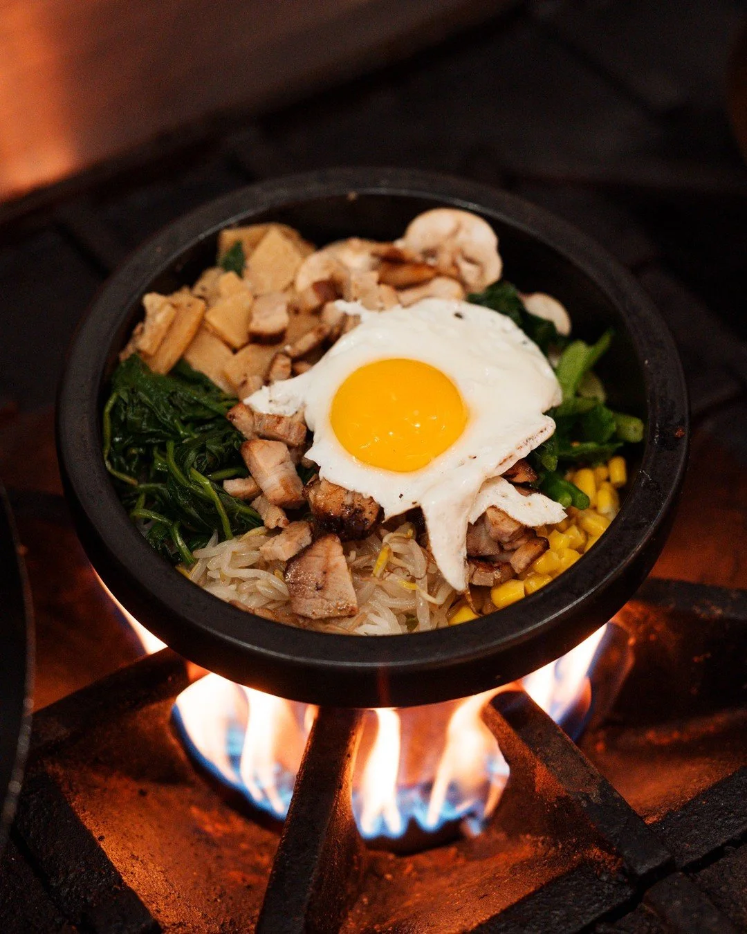Mix, match, and dig in! Fresh vegetables, rice, and an egg come together in a sizzling stone bowl with spicy gochujang sauce. Quick, filling, and full of flavor! Perfect for lunch, dinner, or a night out with friends!🍳💗