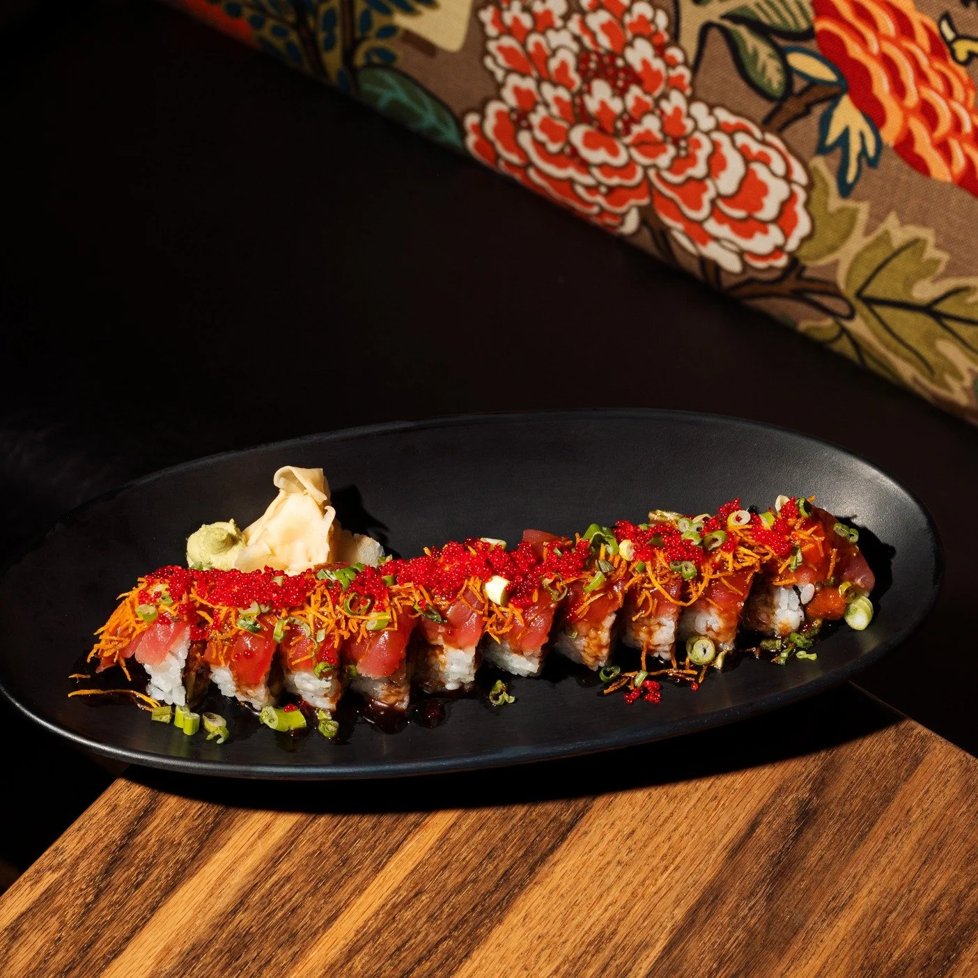 A modern twist on a classic: delicate spicy tuna, creamy avocado, and crisp cucumber, finished with tuna, sushi sauce, sweet potato crunch, sriracha, scallions, and masago! Crispy Tuna Roll, the ultimate Iya experience🍣