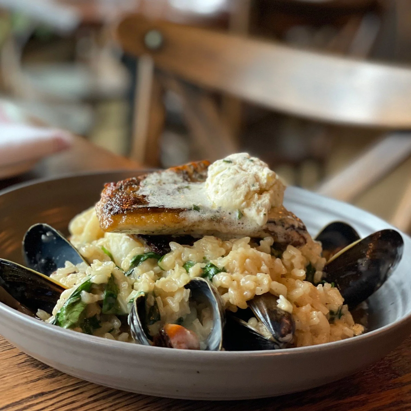 Elegant flavors, perfectly balanced 🐟 Barramundi with citrus butter and seafood spinach risotto