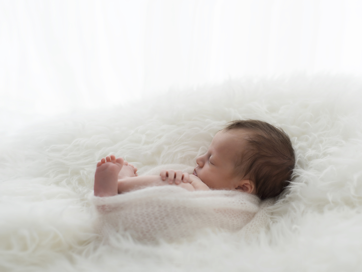 Newborn baby curled